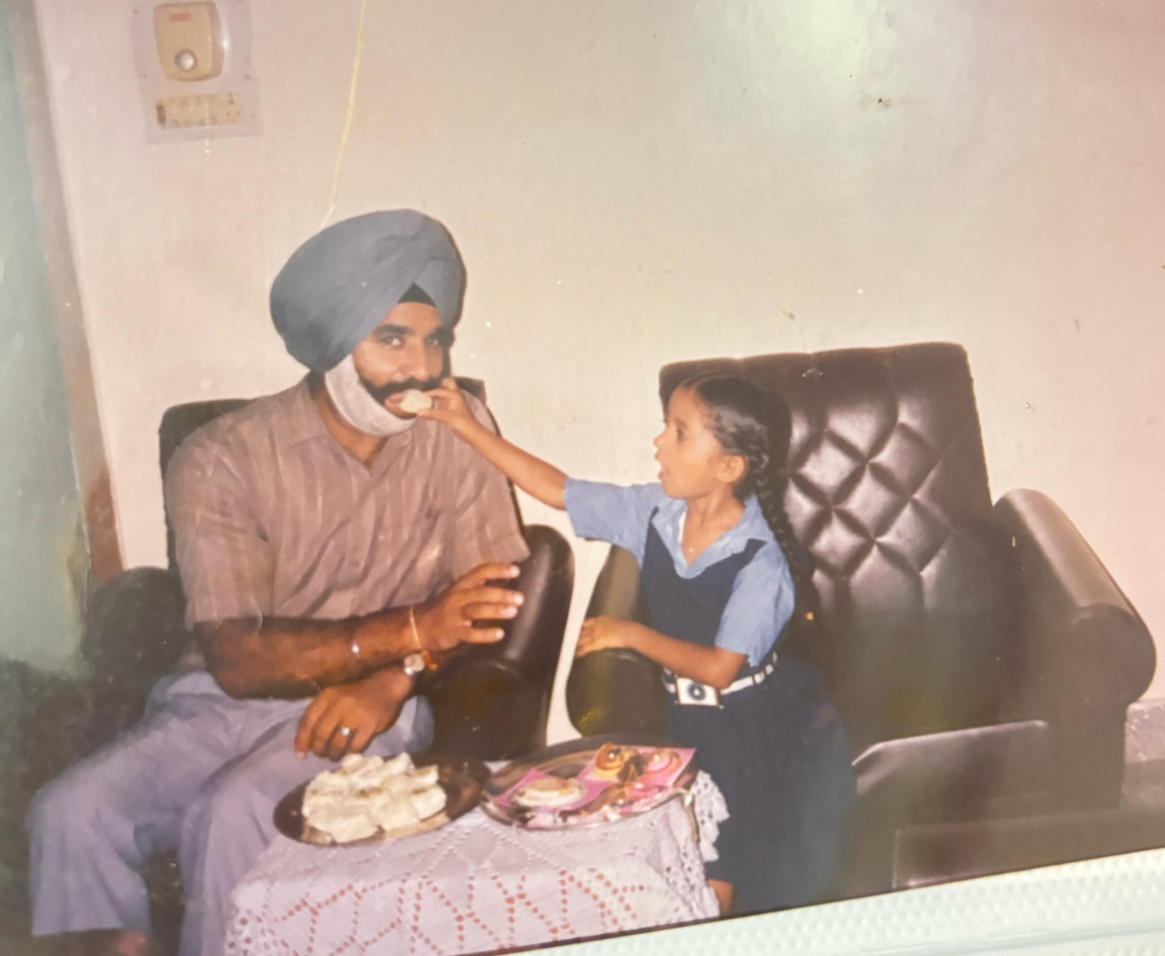 A man and a child sitting in a chair
