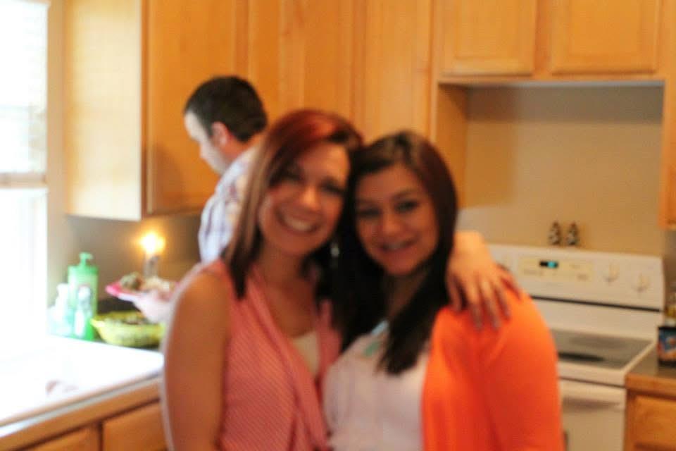 A couple of women in a kitchen