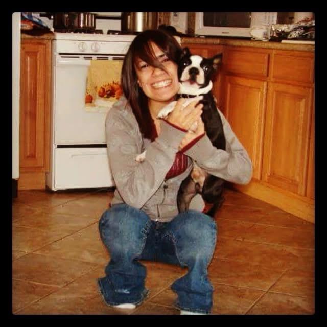 A woman holding a dog