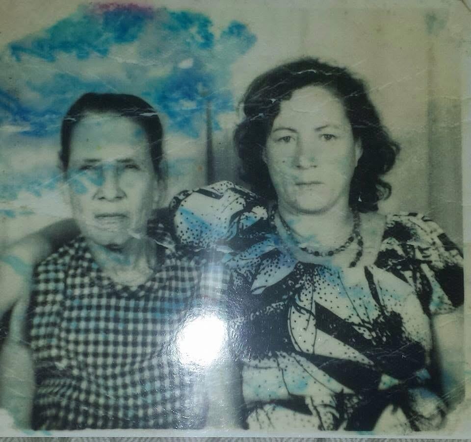 A woman sitting next to another woman
