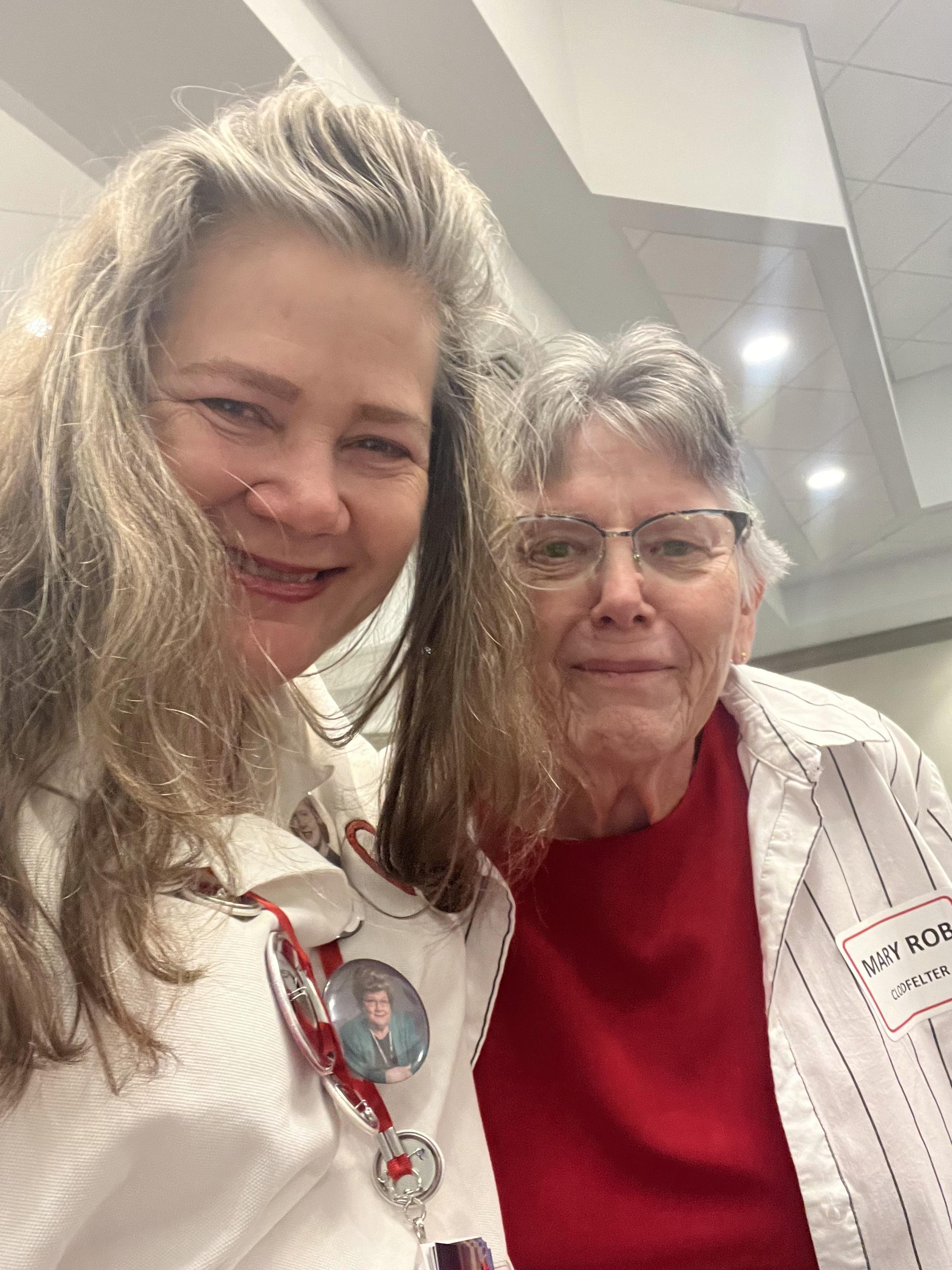 Two women smiling at the camera