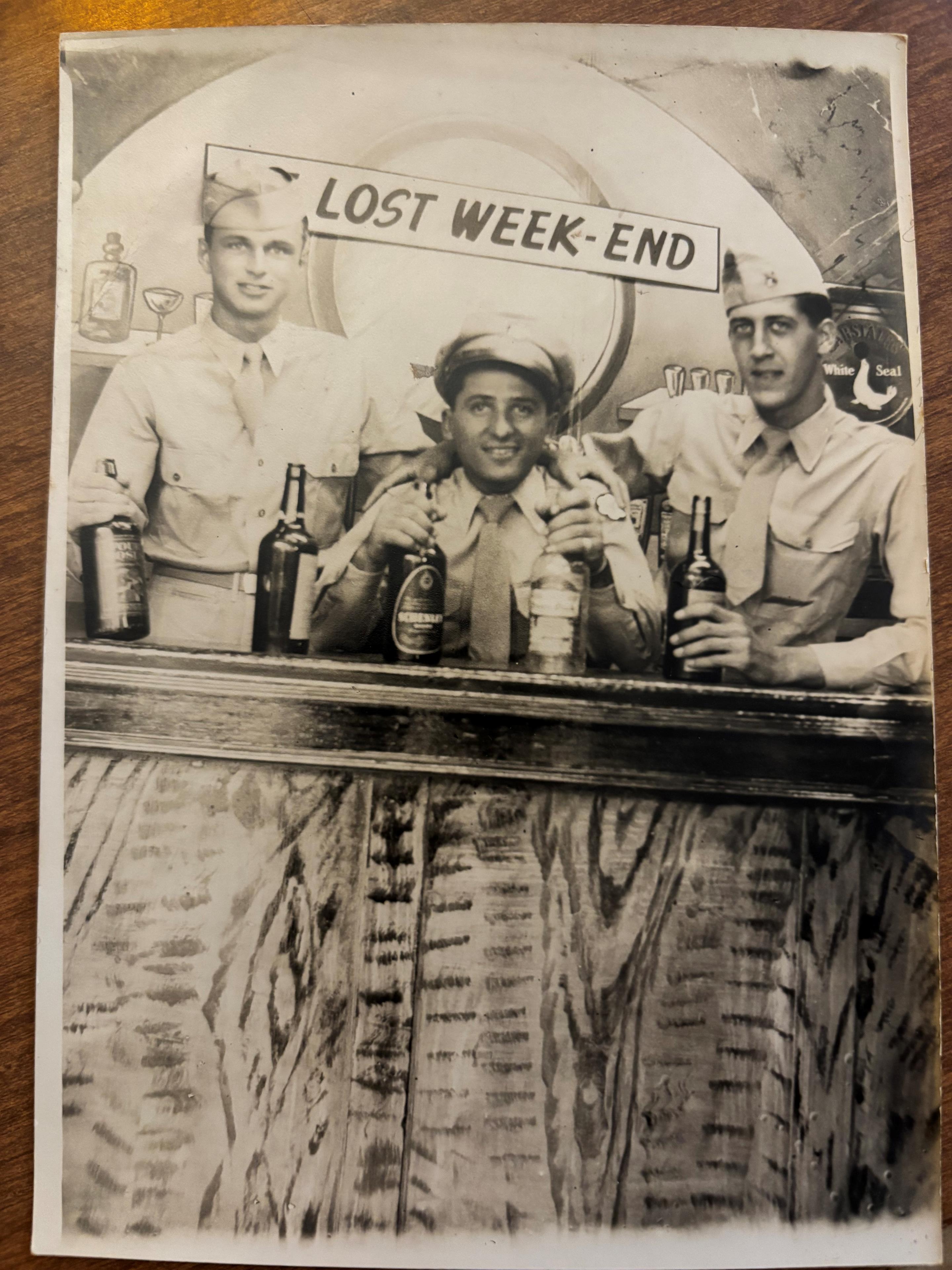 A group of men sitting at a bar