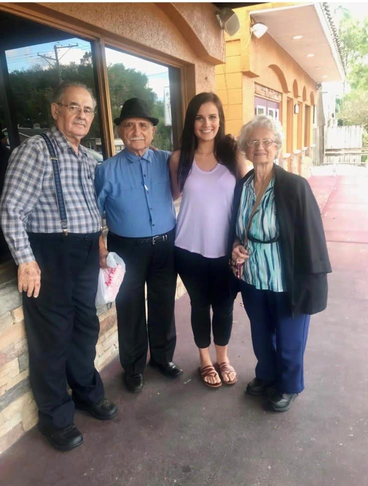 A group of people standing outside a building