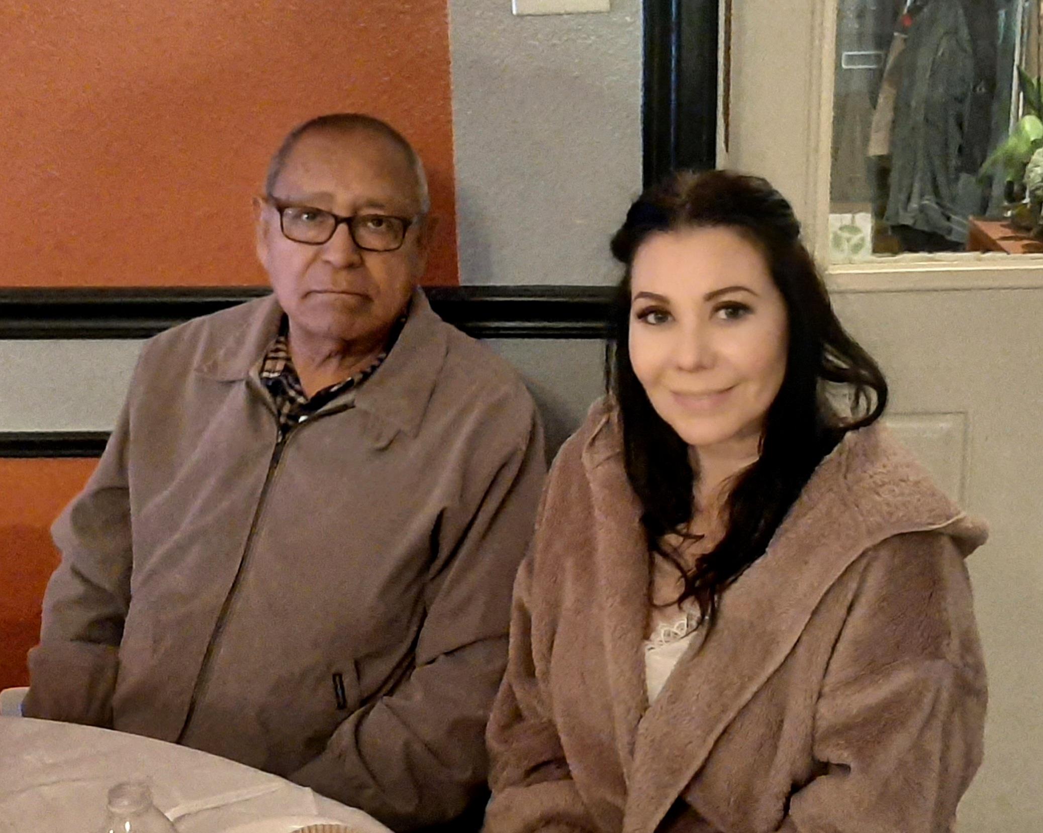 A man and woman sitting at a table