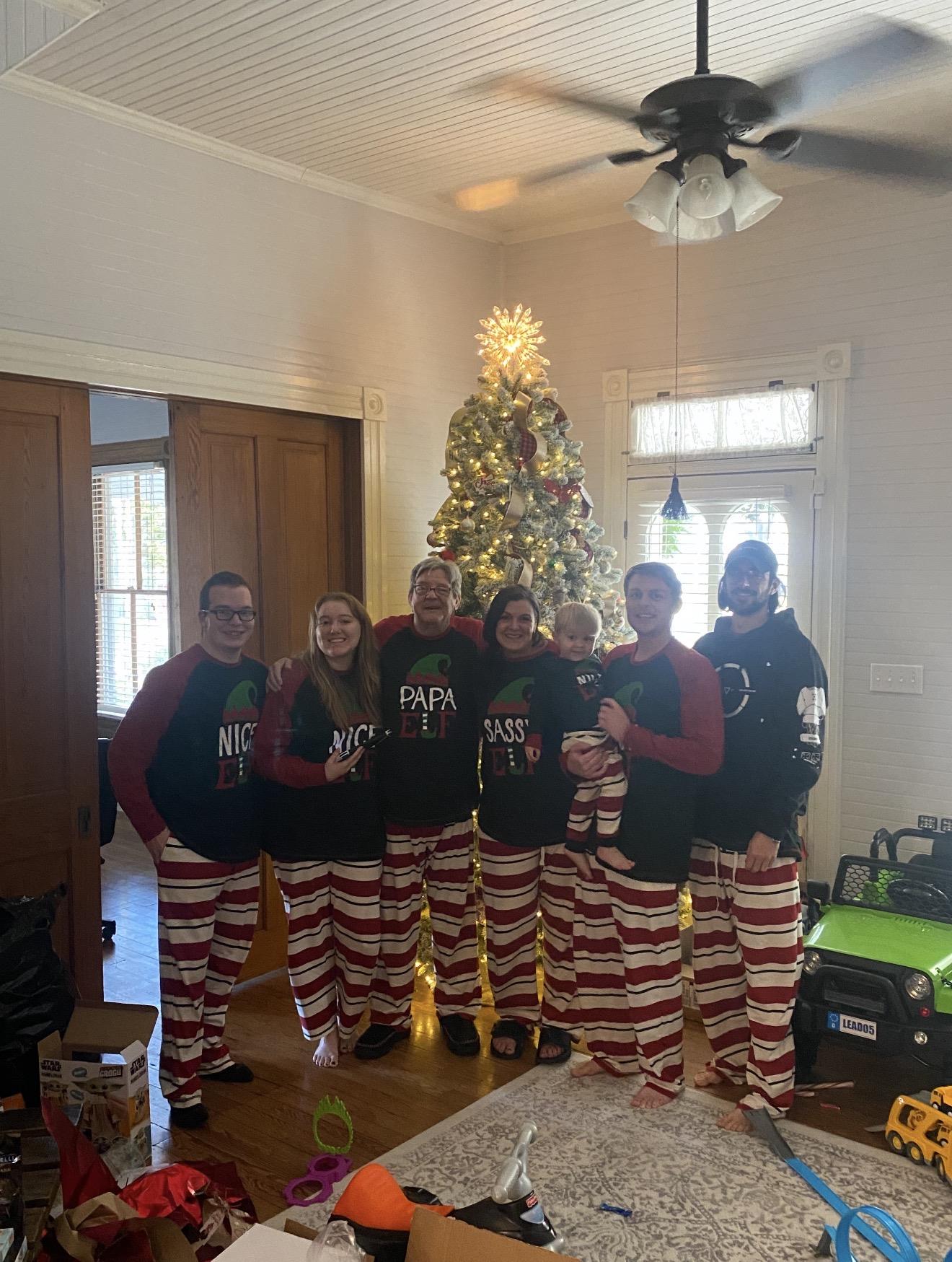 A group of people in pajamas posing for a photo