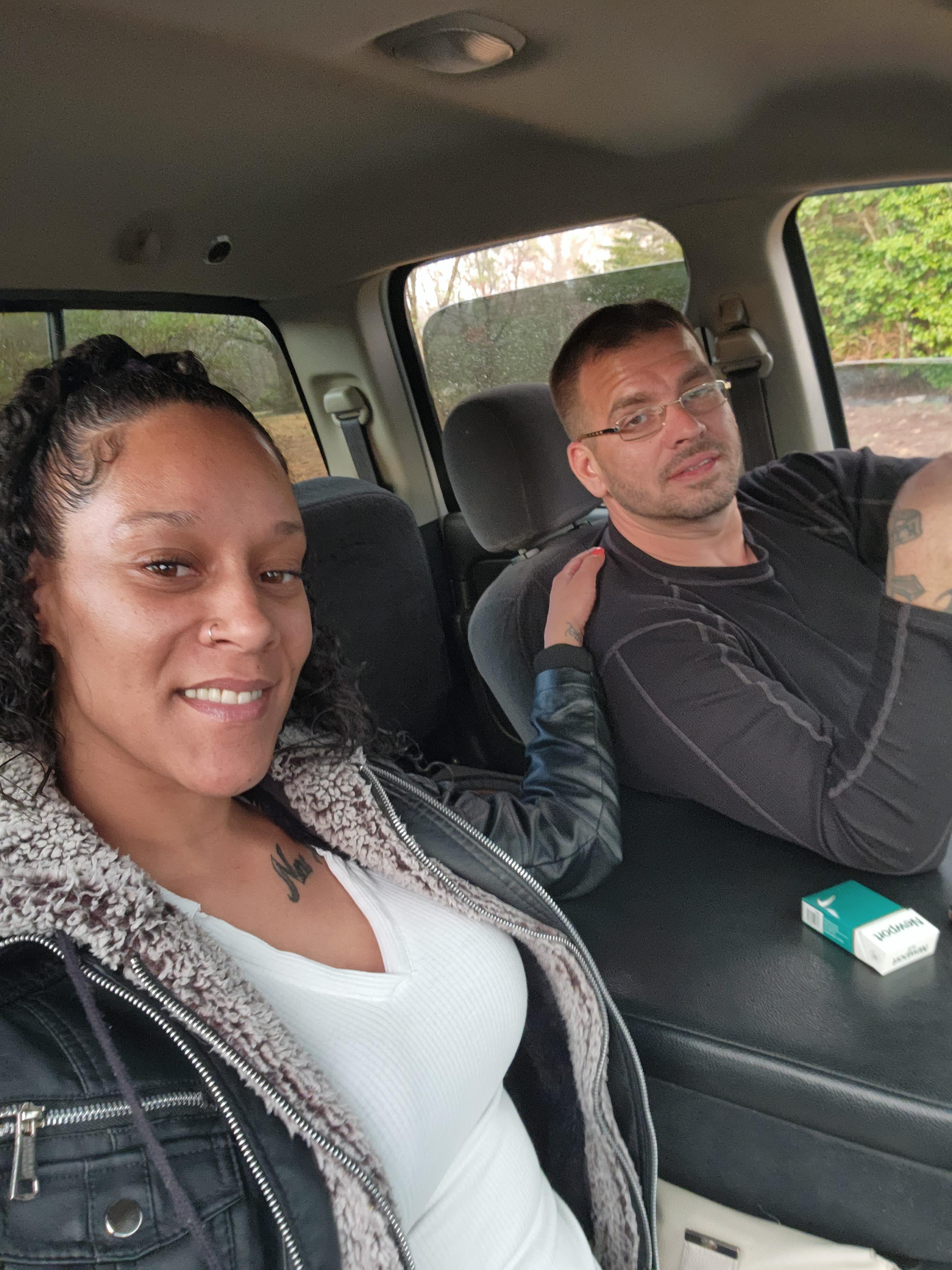 A man and woman in a car