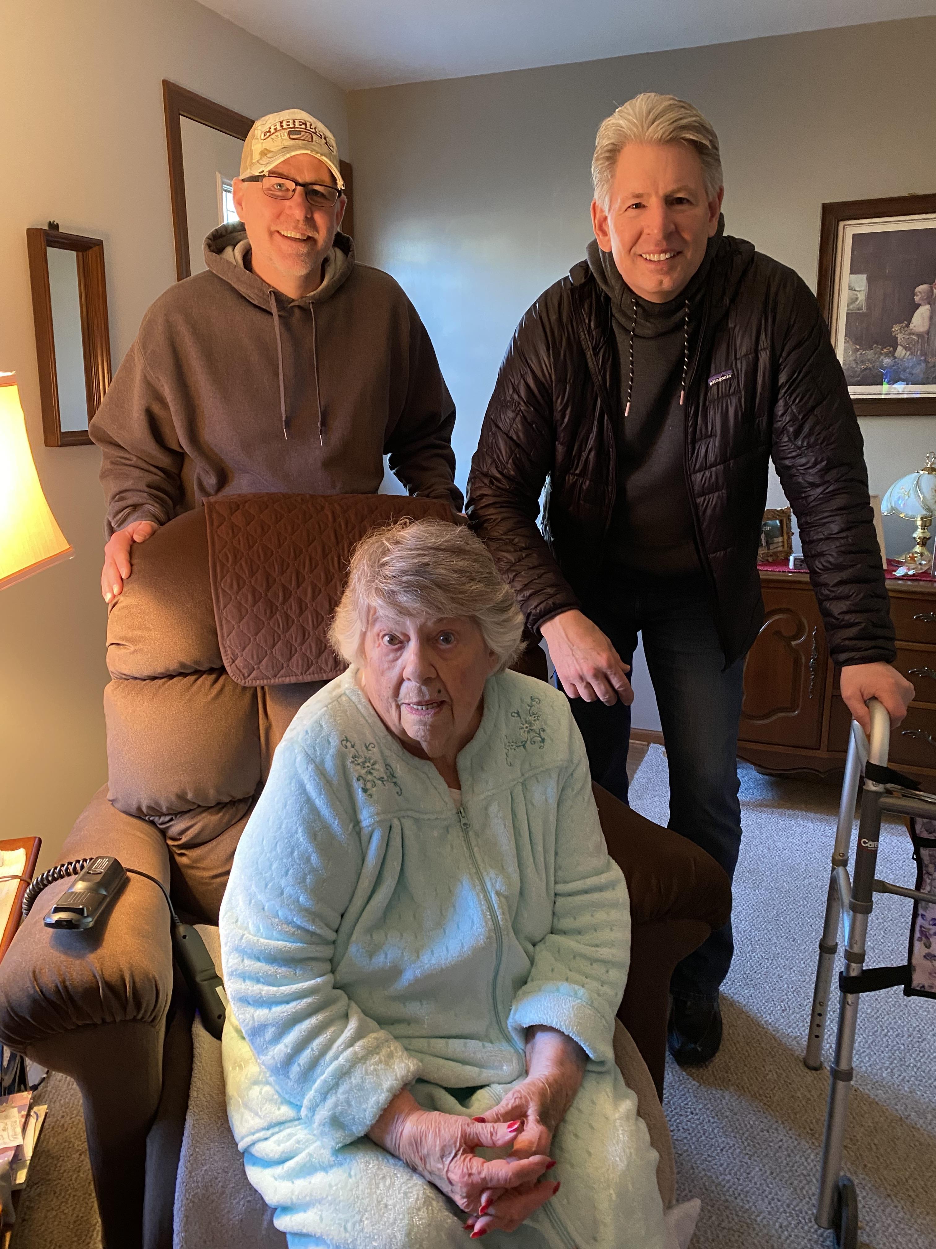 A group of people standing in a living room