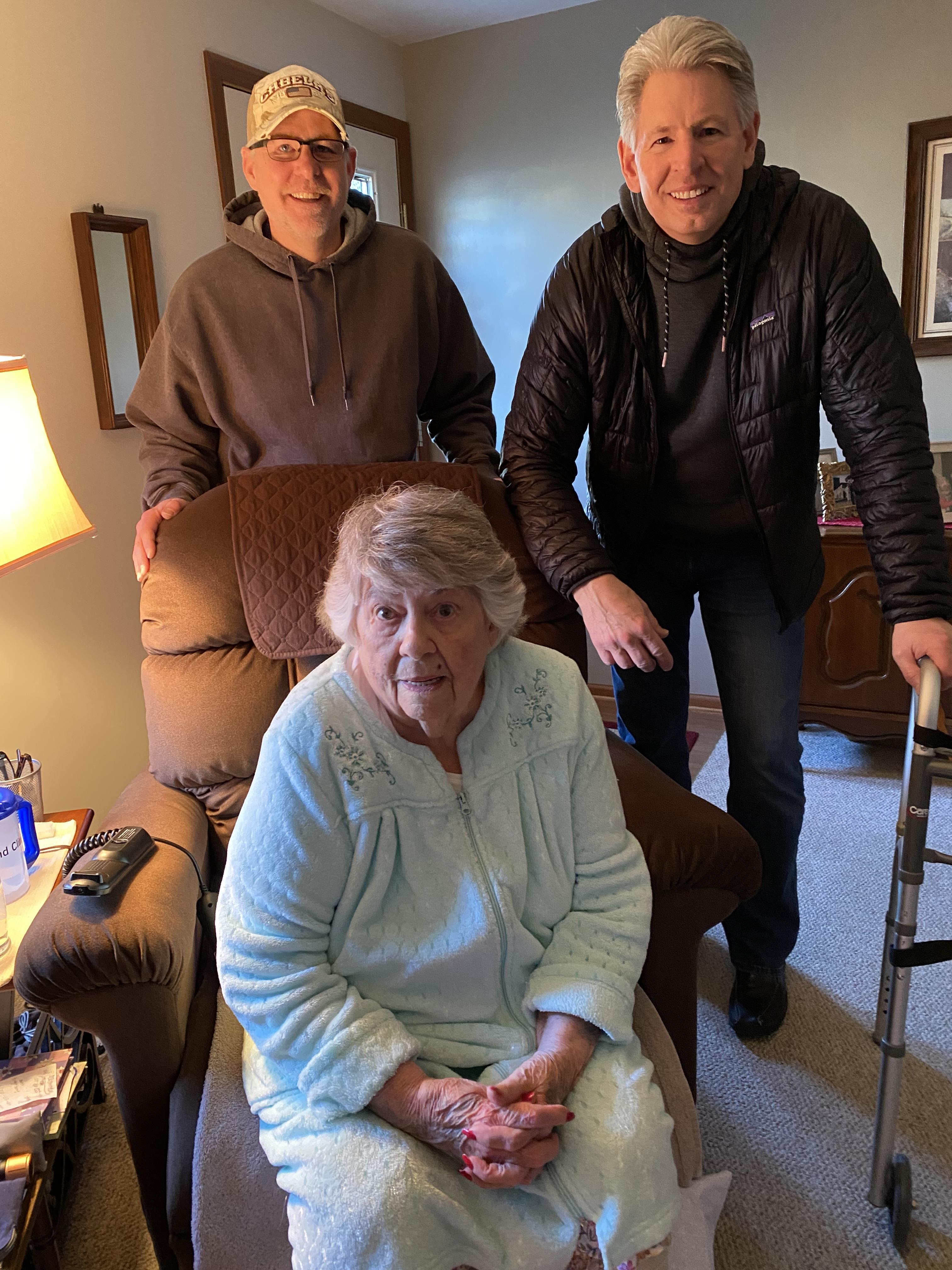 A group of people standing in a living room