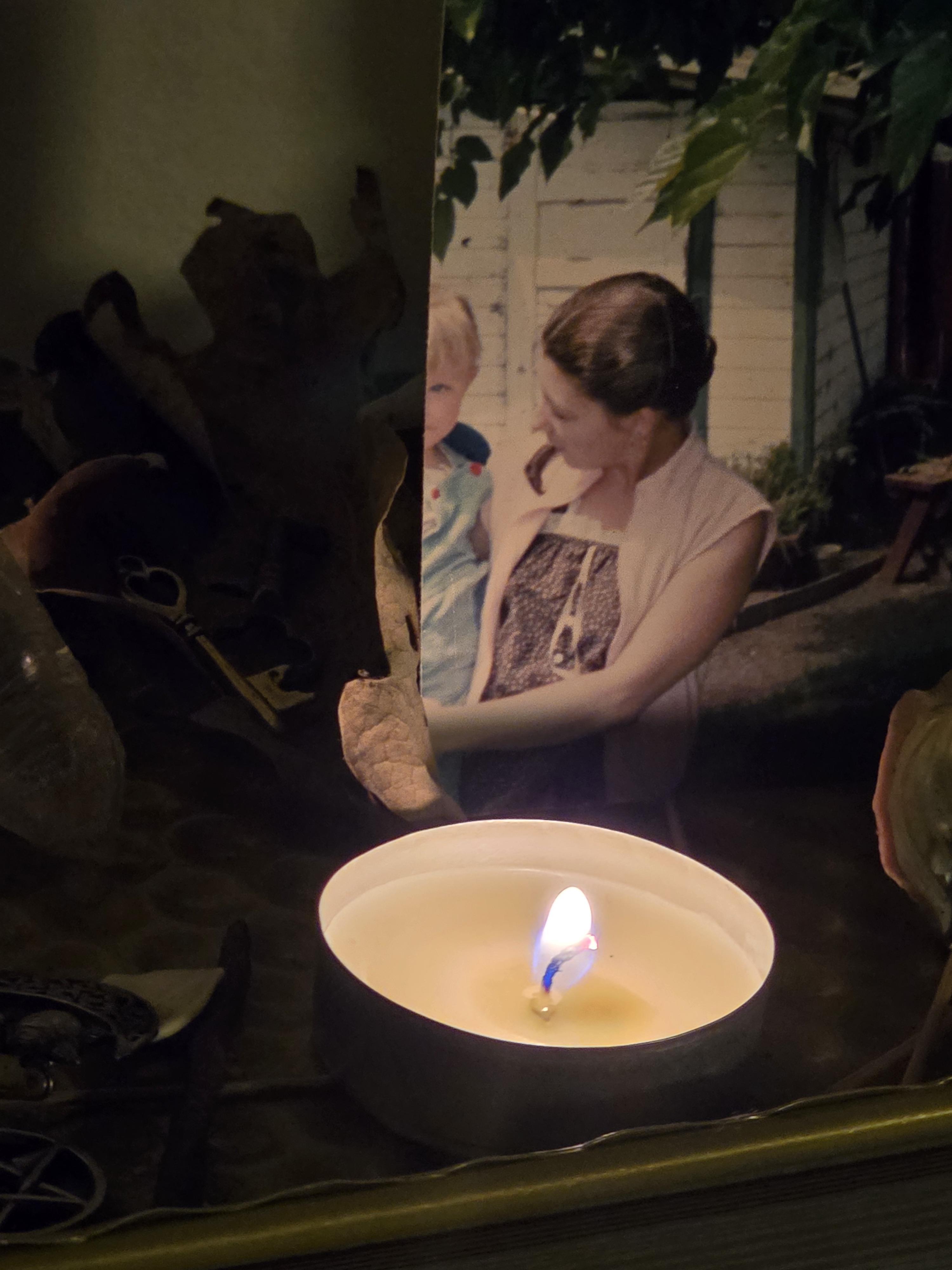 A candle lit in a bowl