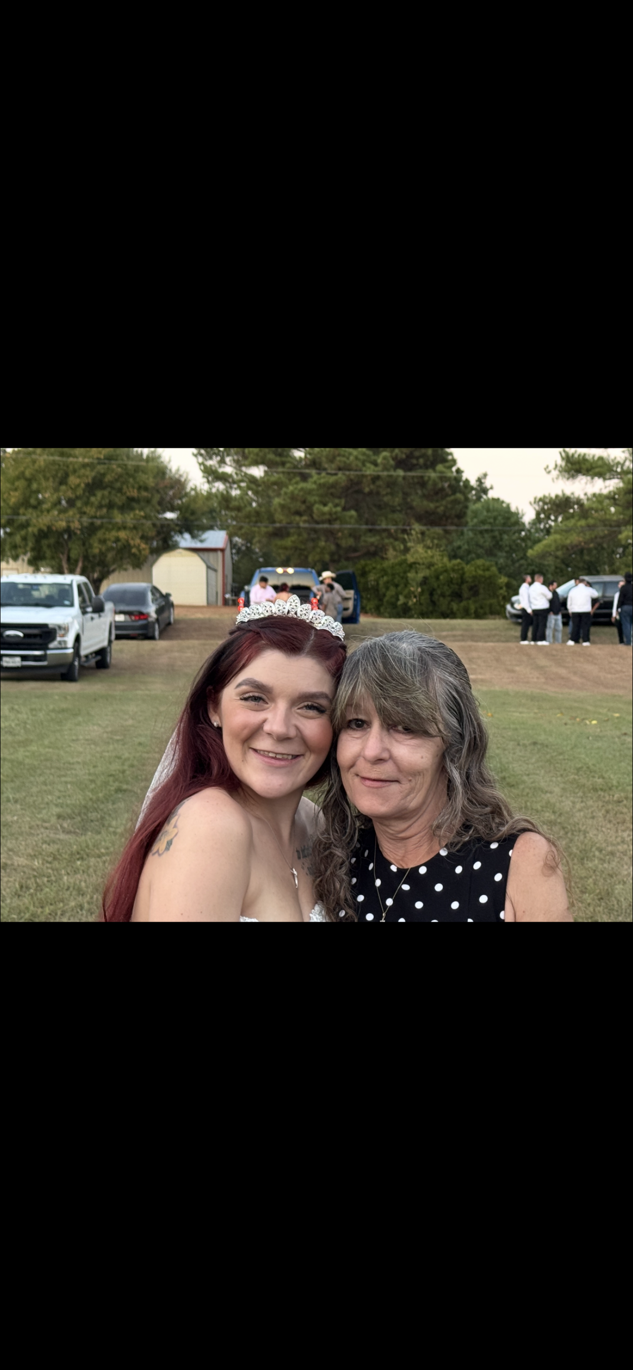 A woman and woman posing for a picture