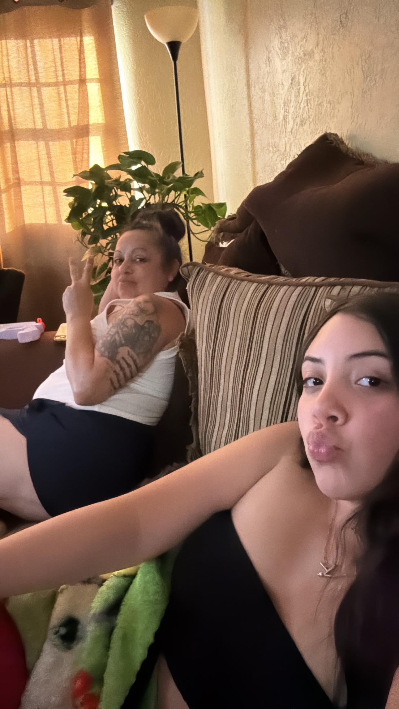 Two women sitting on a couch