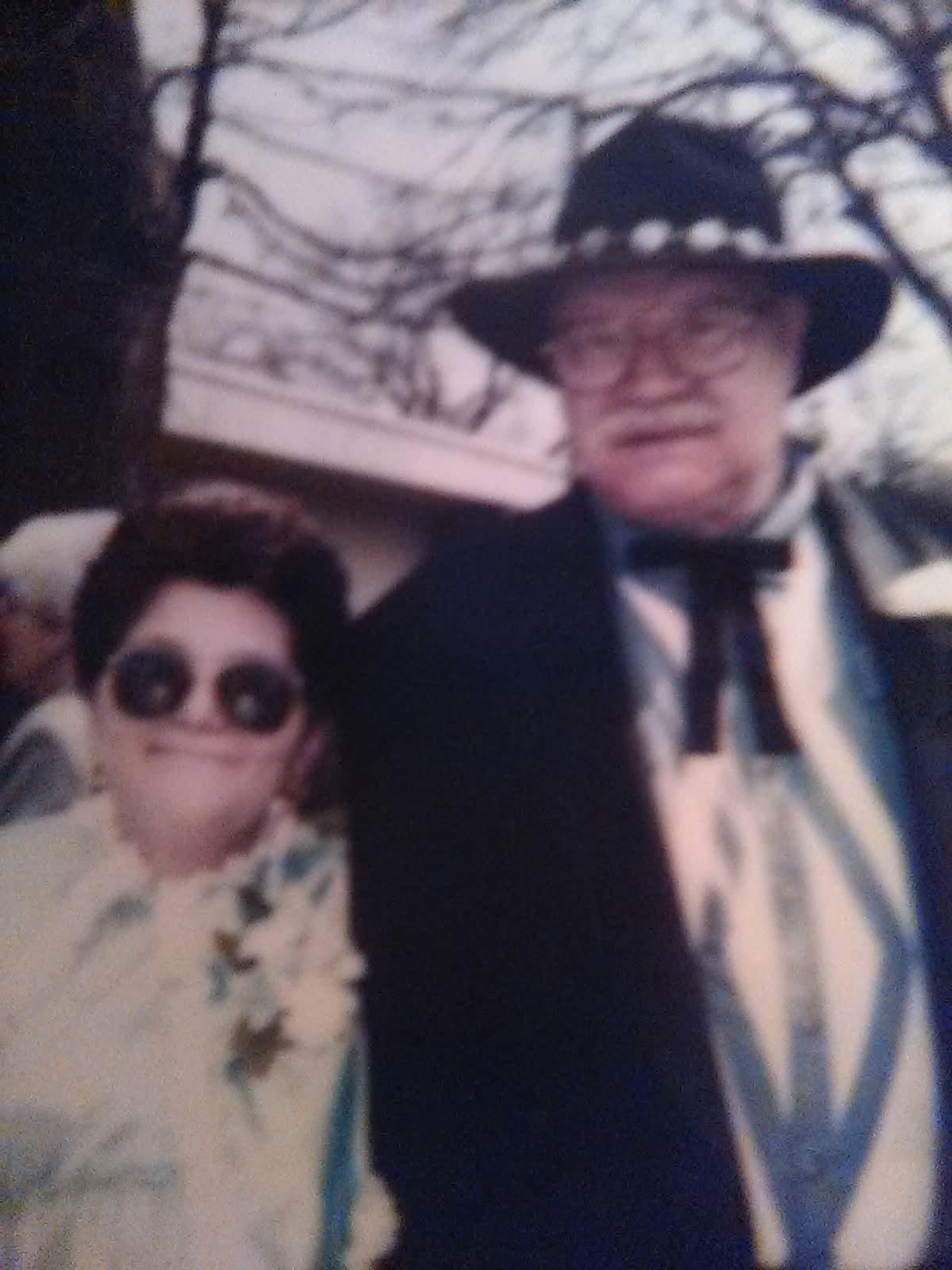 A man and woman posing for a picture