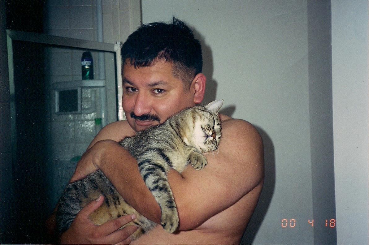 A man holding a cat