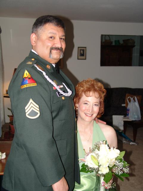 A man in a military uniform and a woman in a dress