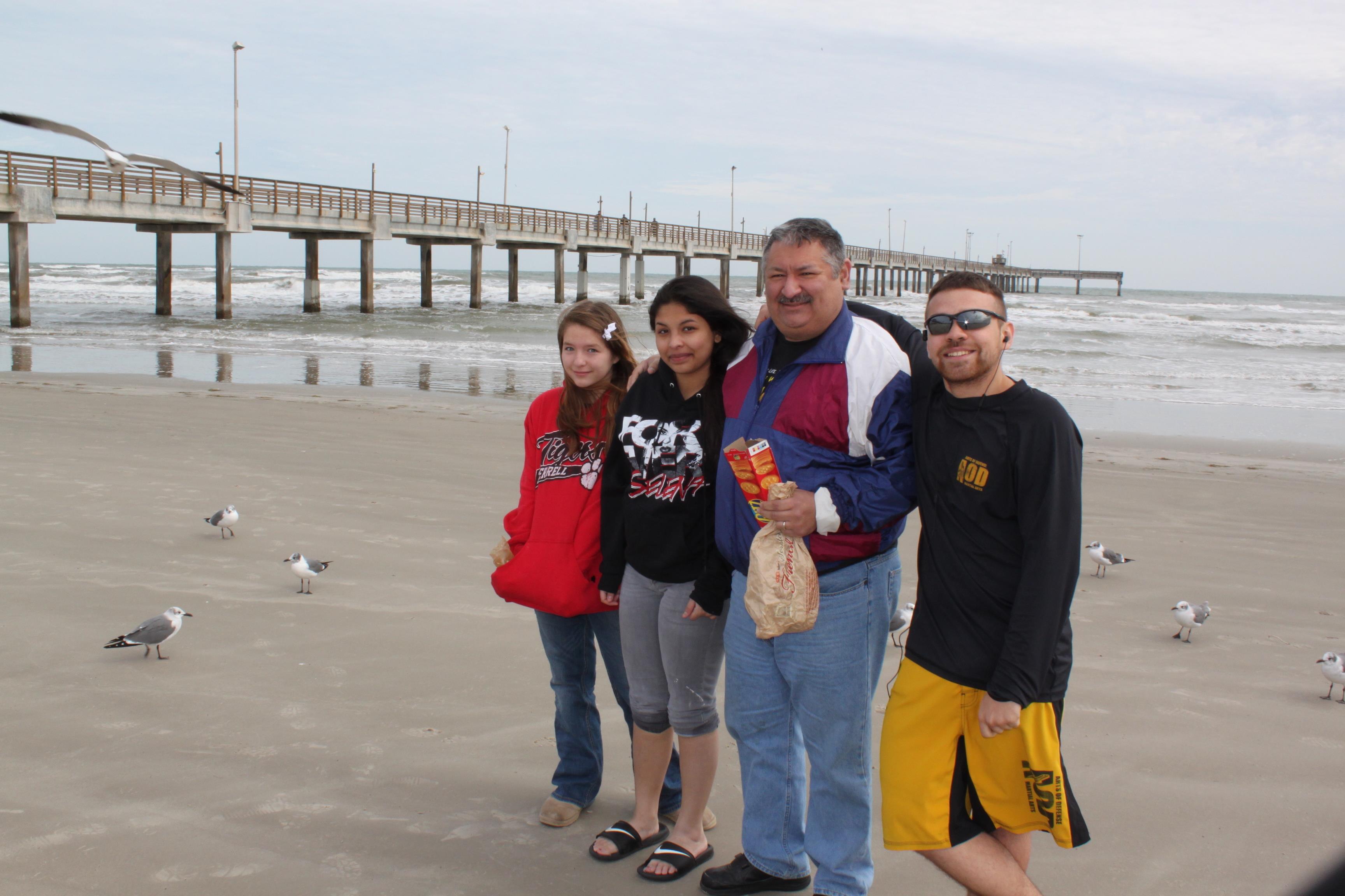 A group of people standing on a beach