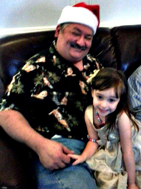 A man and a girl sitting on a couch