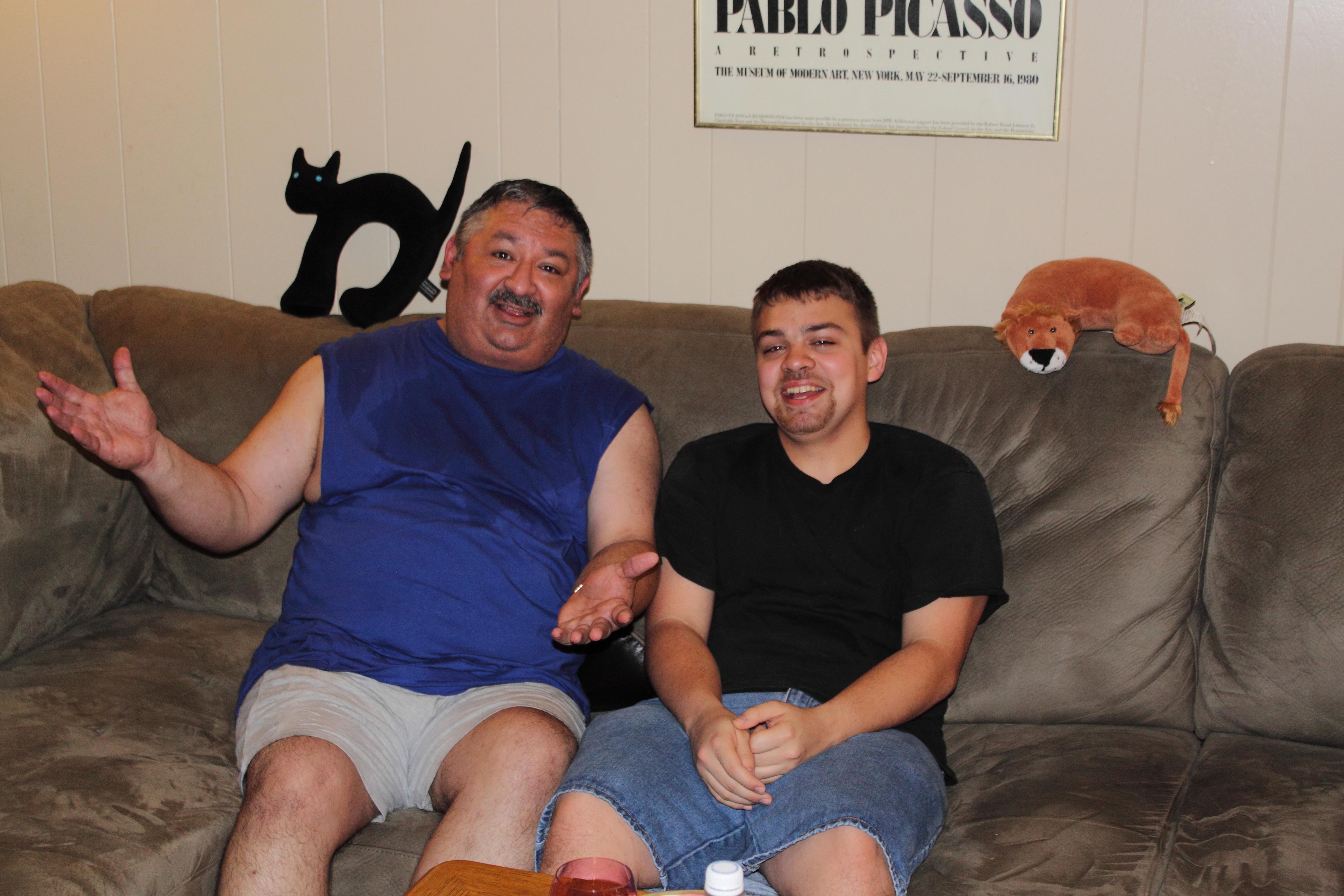 Two men sitting on a couch