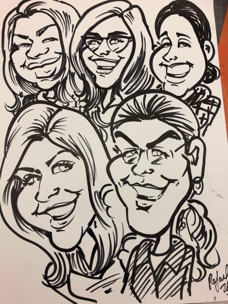 A group of people with their faces drawn on a white paper