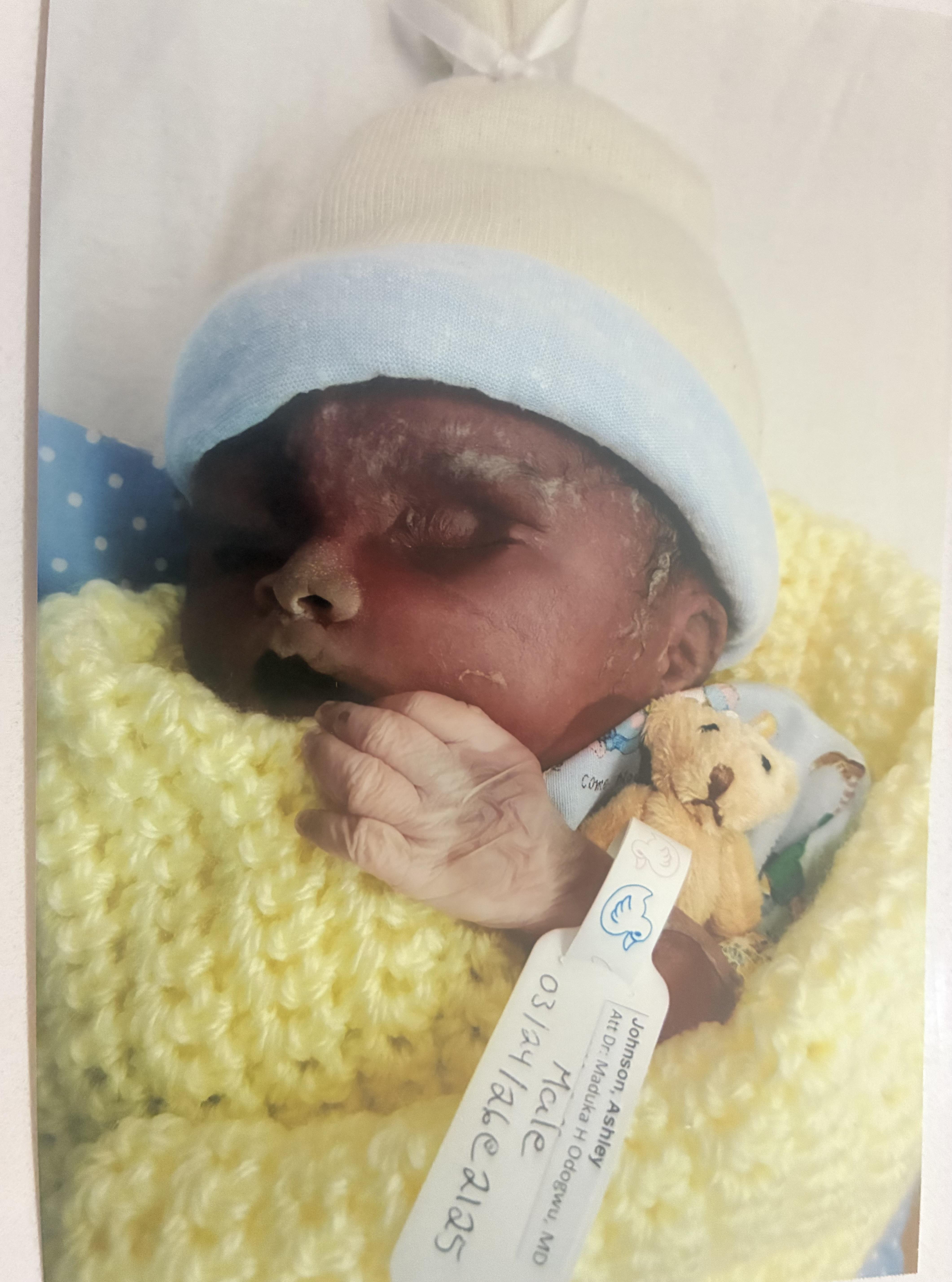 A baby with a teddy bear