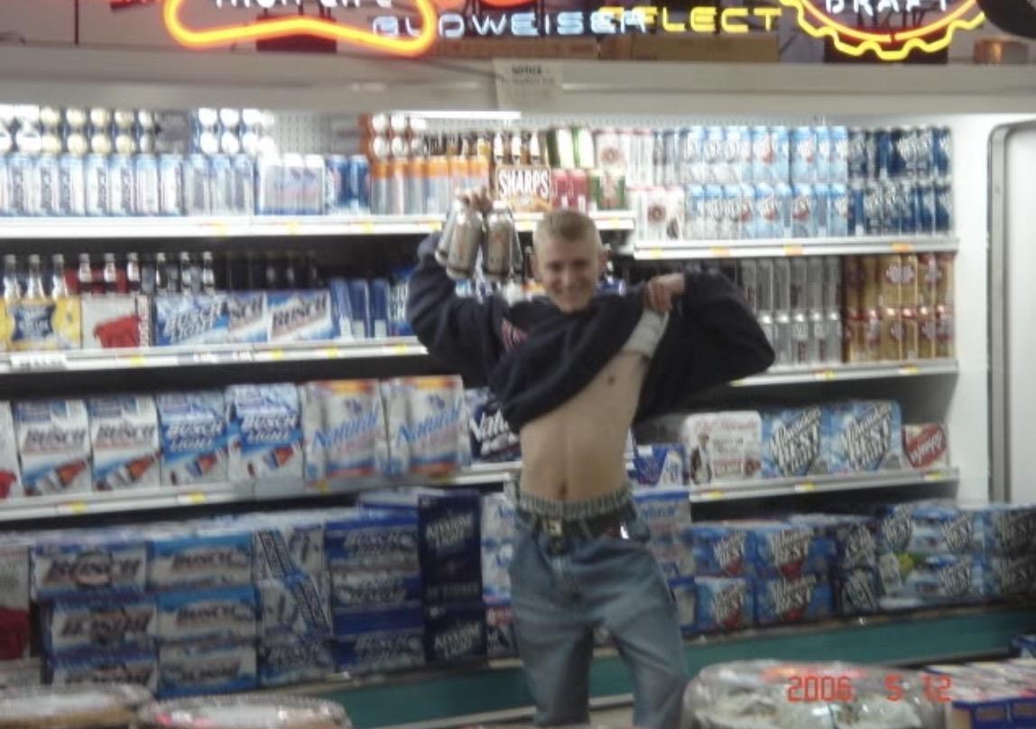 A man holding up a mug