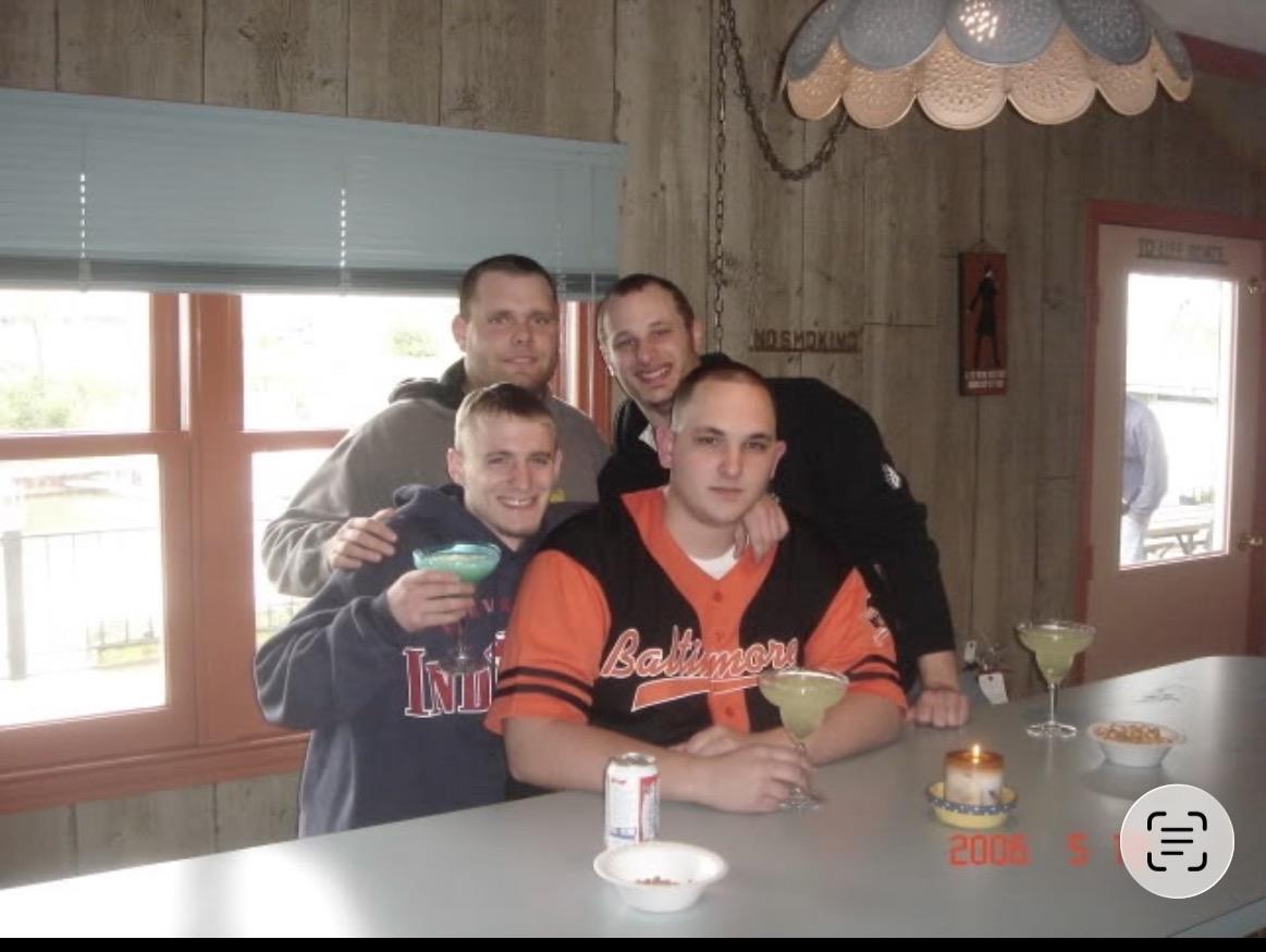 A group of men posing for a photo