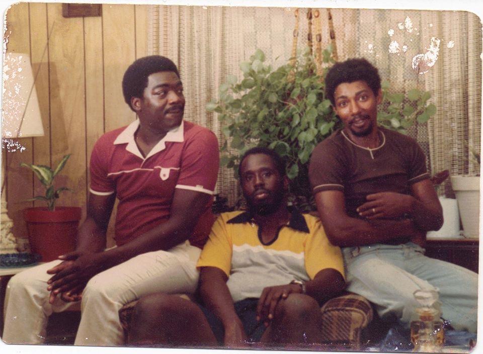 A group of men sitting on a couch