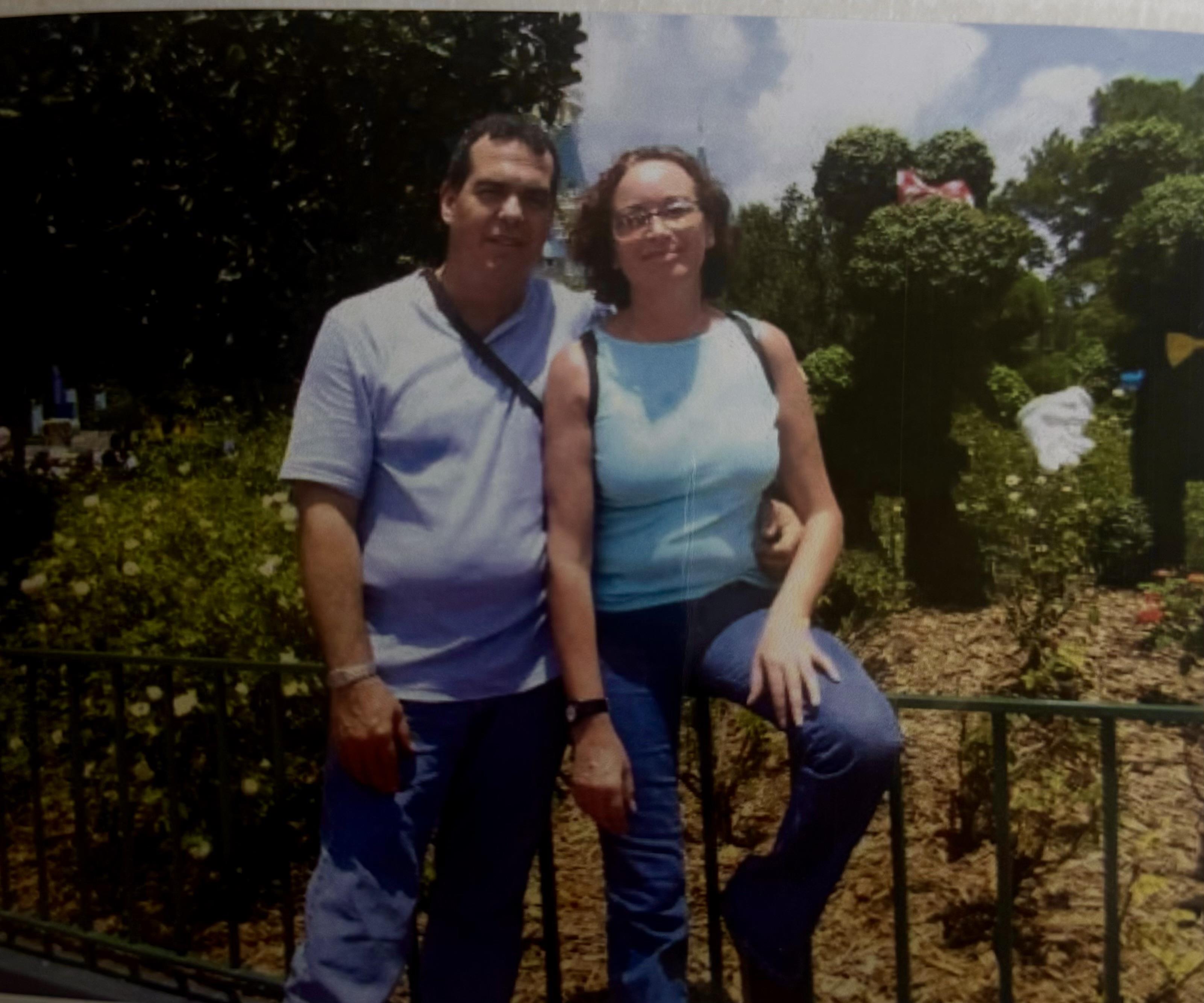 A man and woman posing for a picture