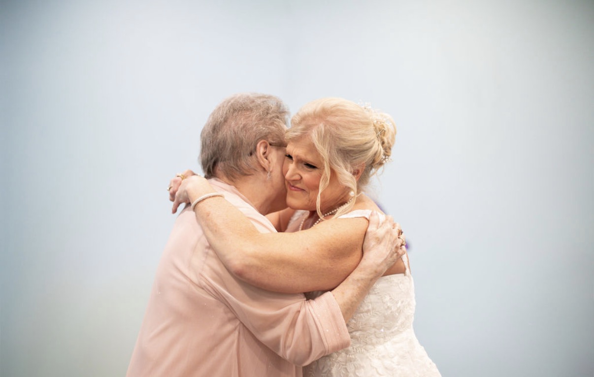 A woman hugging a man