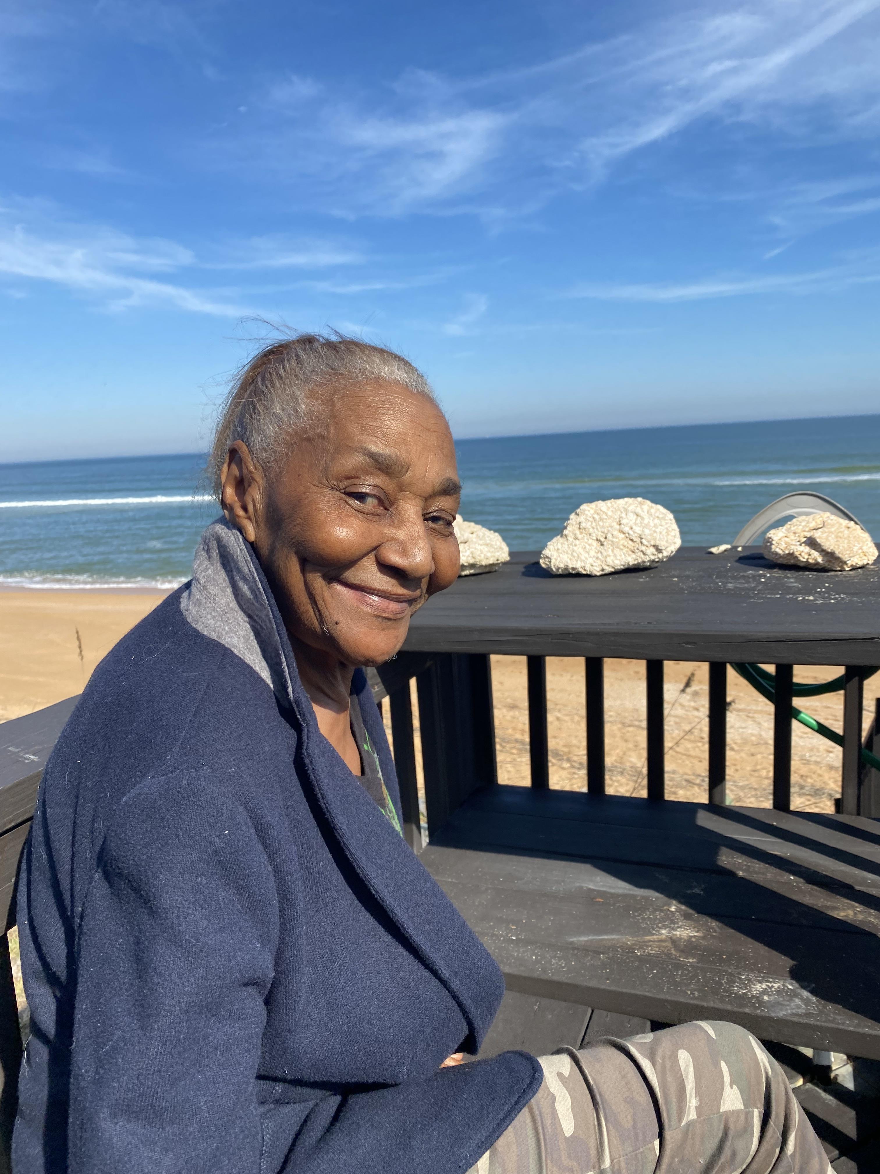 A woman smiling at the camera