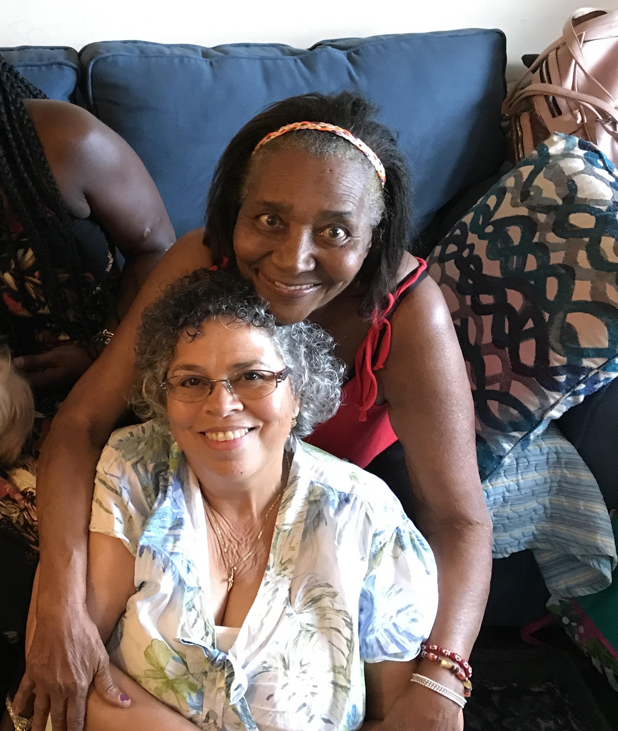 Two women sitting on a couch