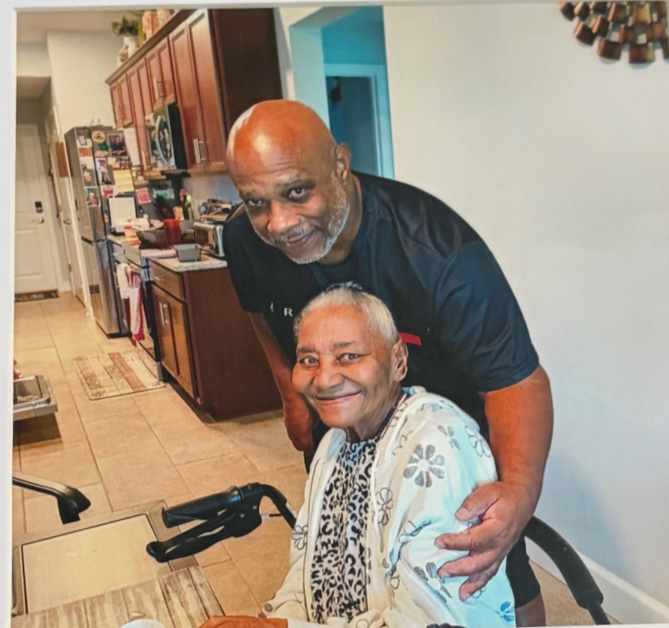 A man and woman in a kitchen