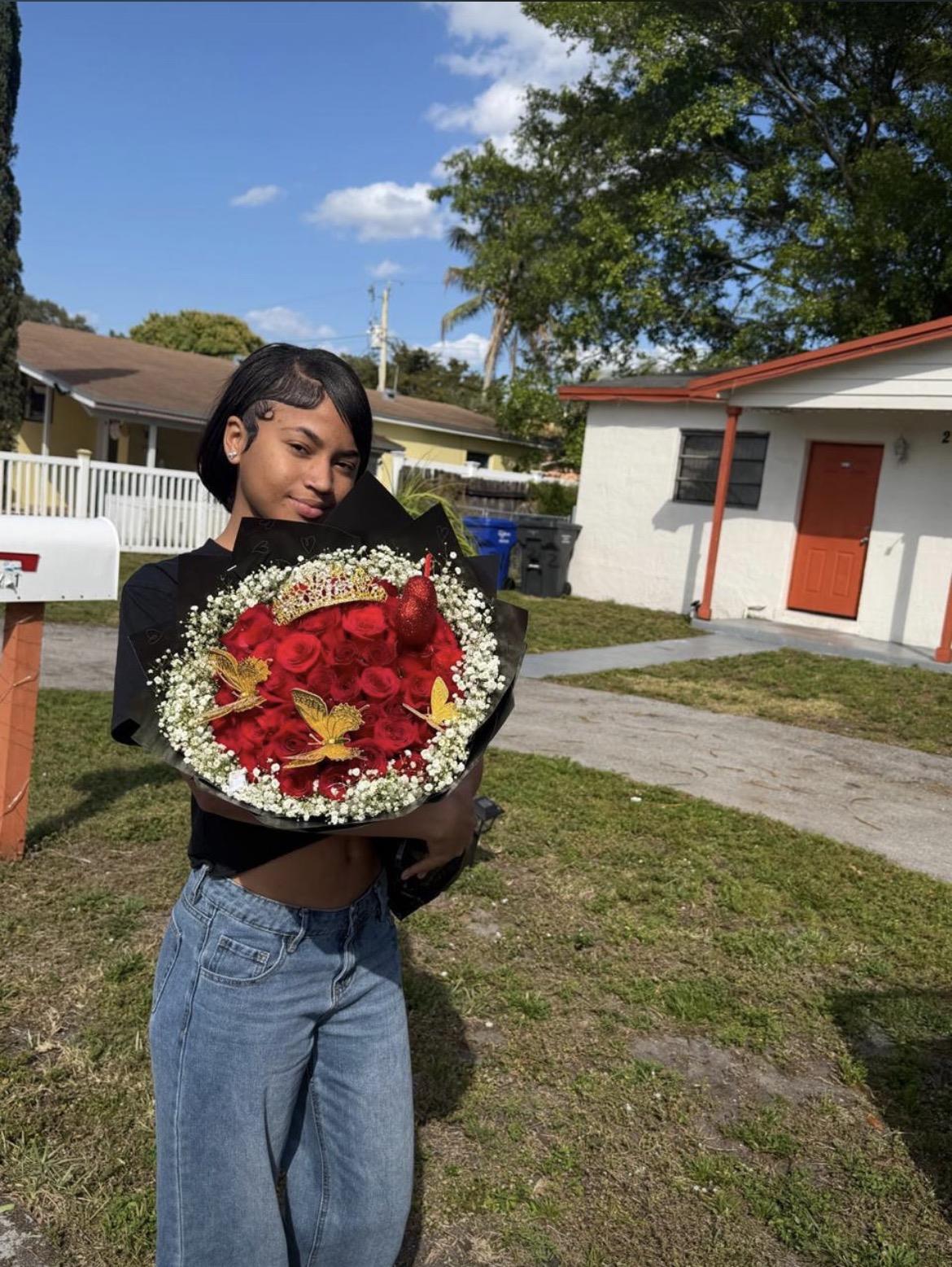 A woman holding a bouquet of flowers