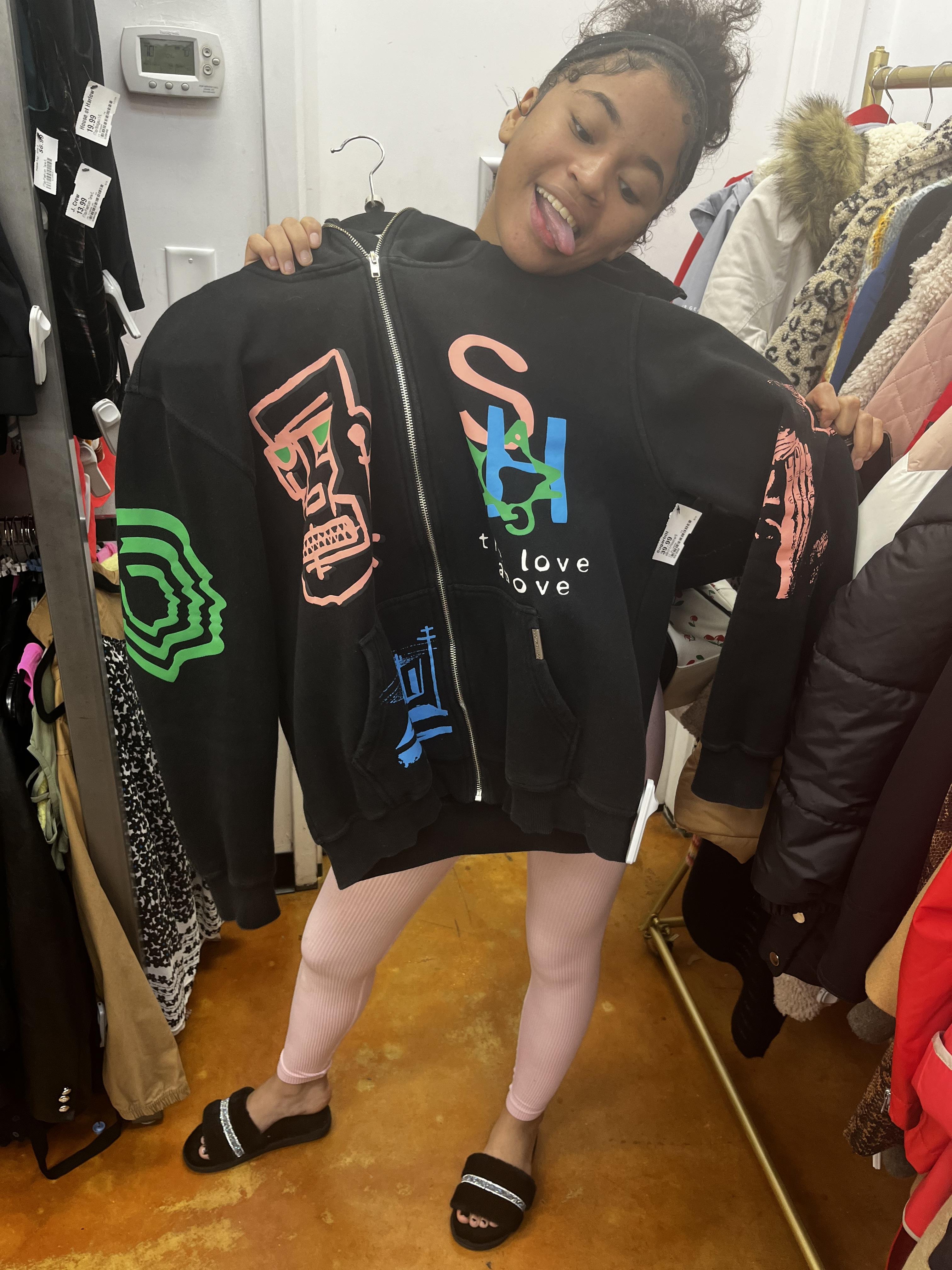 A girl holding a jacket