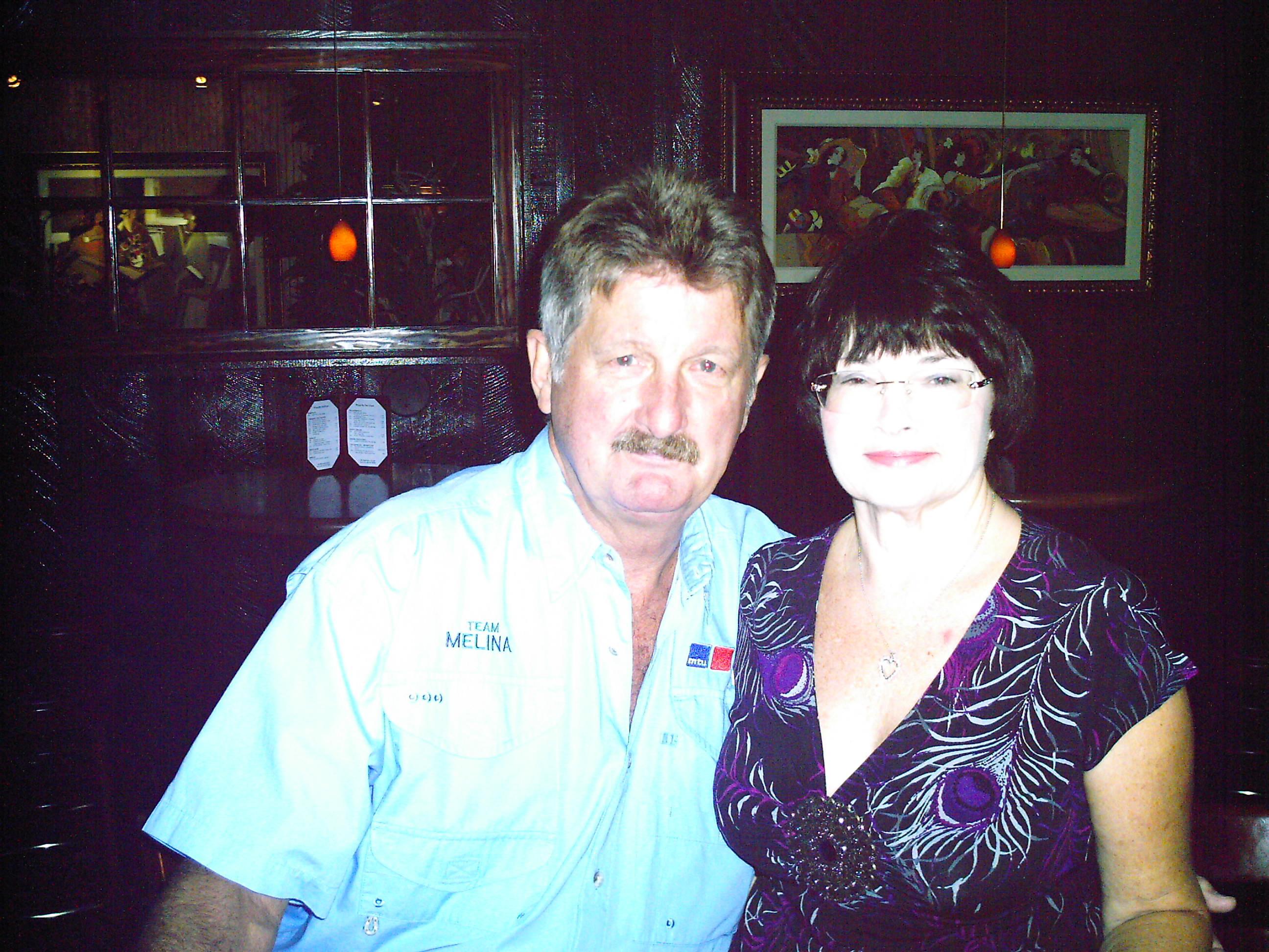 A man and woman posing for a picture