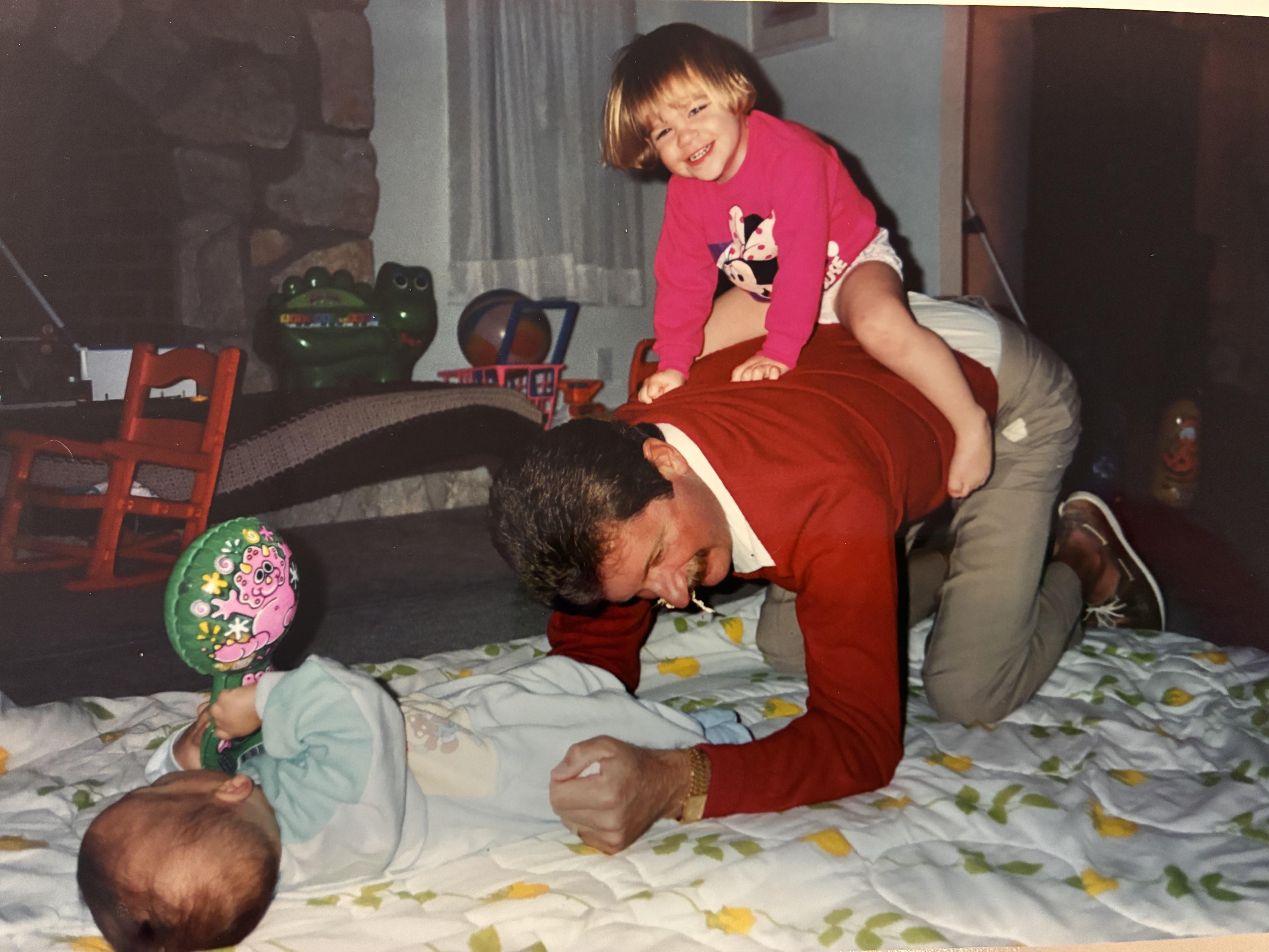 A man and a child on his back