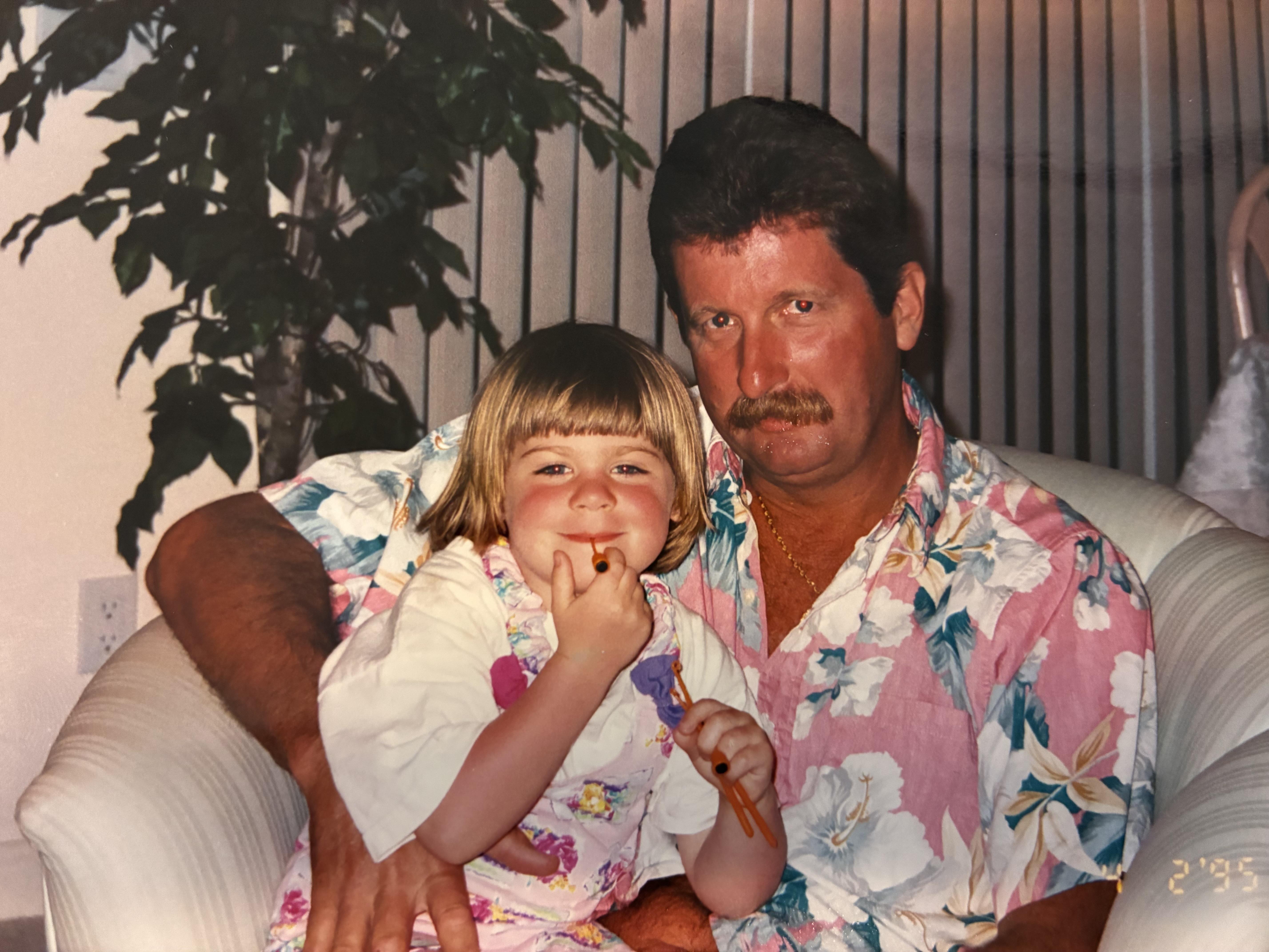 A man and a child posing for a picture