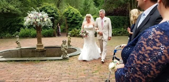 A man and woman walking down a brick path