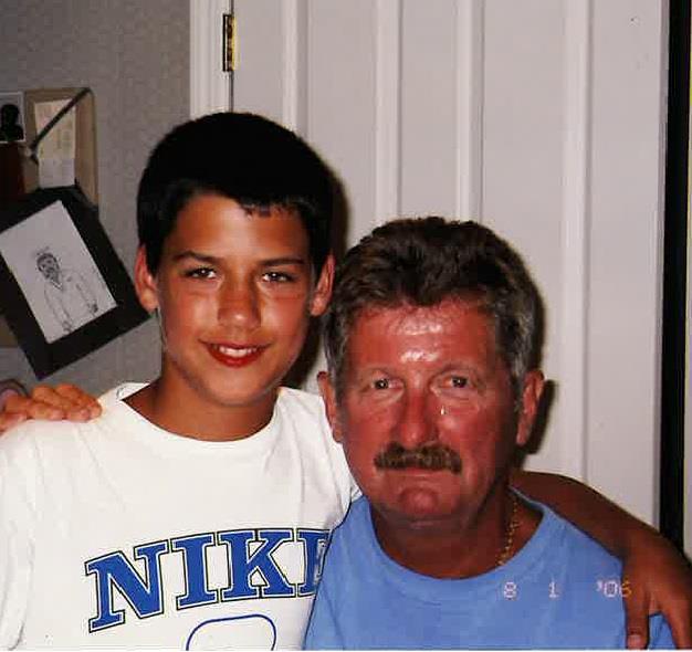 A man and boy posing for a picture