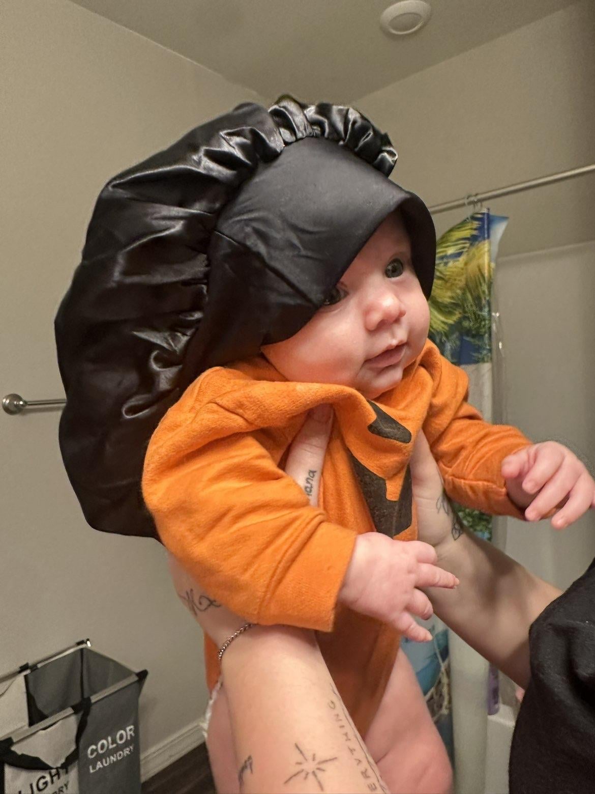A baby wearing a hat