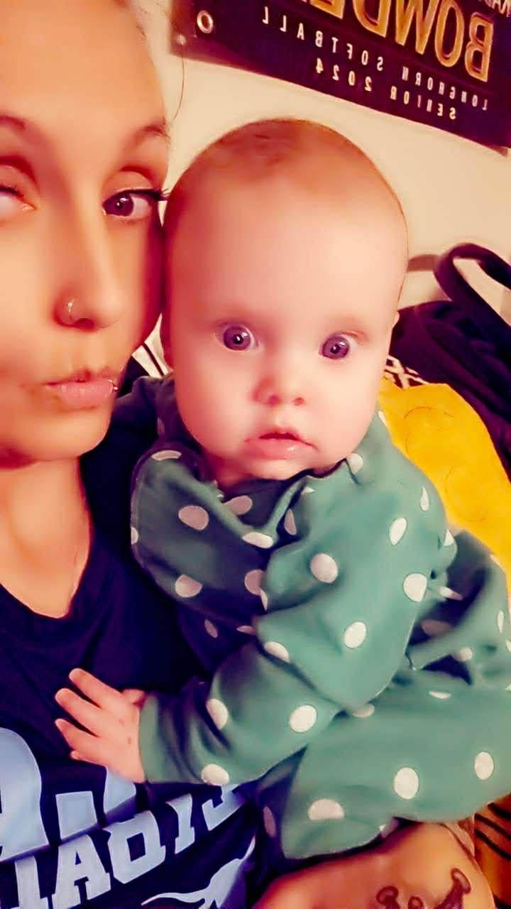 A woman holding a baby