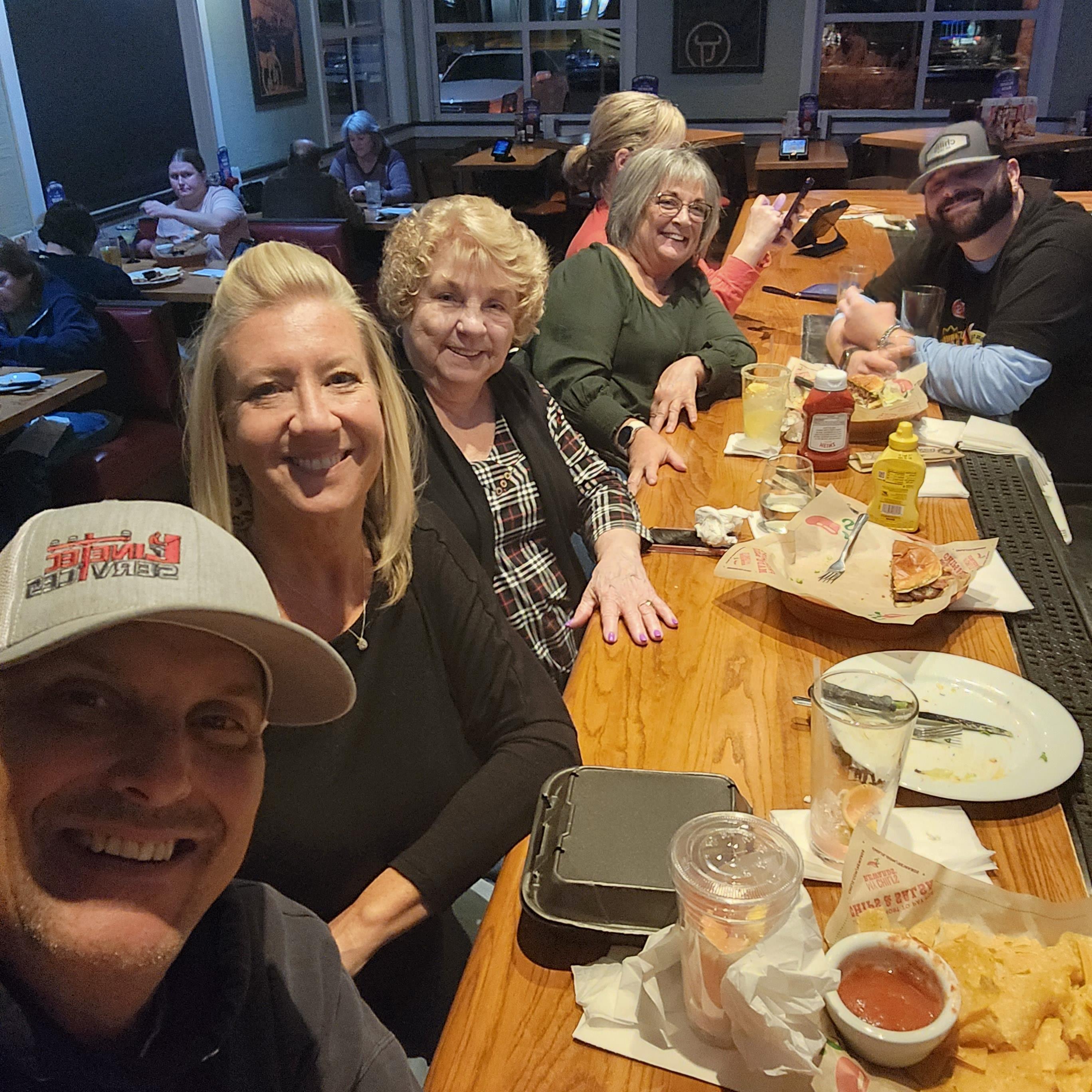 A group of people sitting at a table