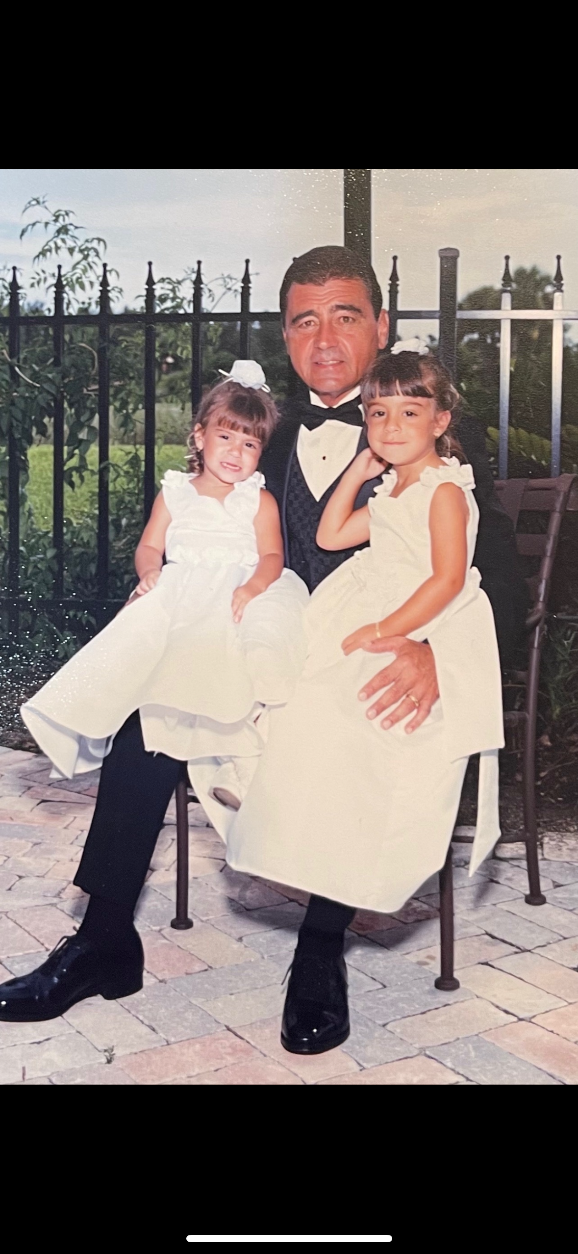 A man and two girls posing for a picture