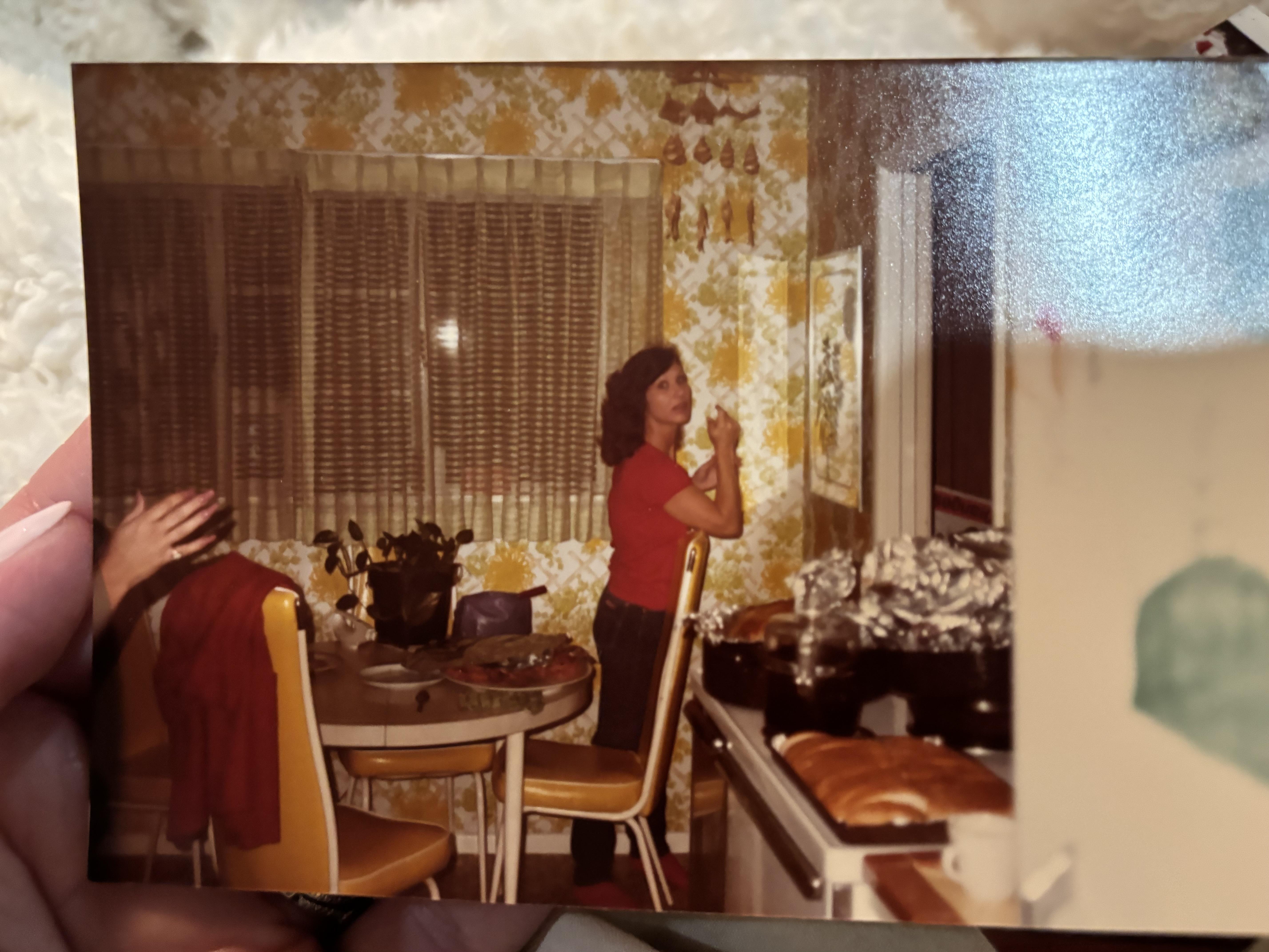 A woman standing in a kitchen