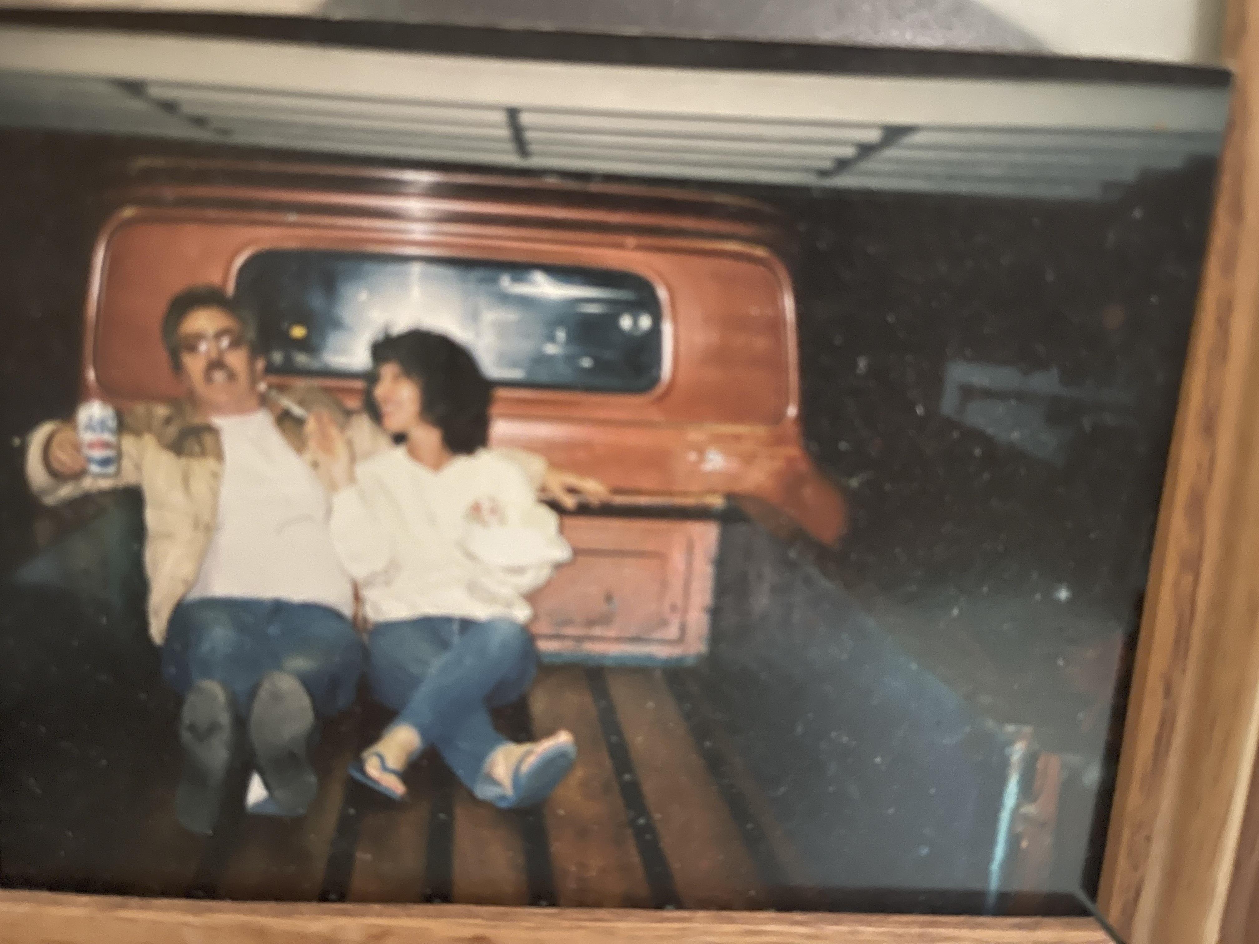 A man and woman sitting in a truck