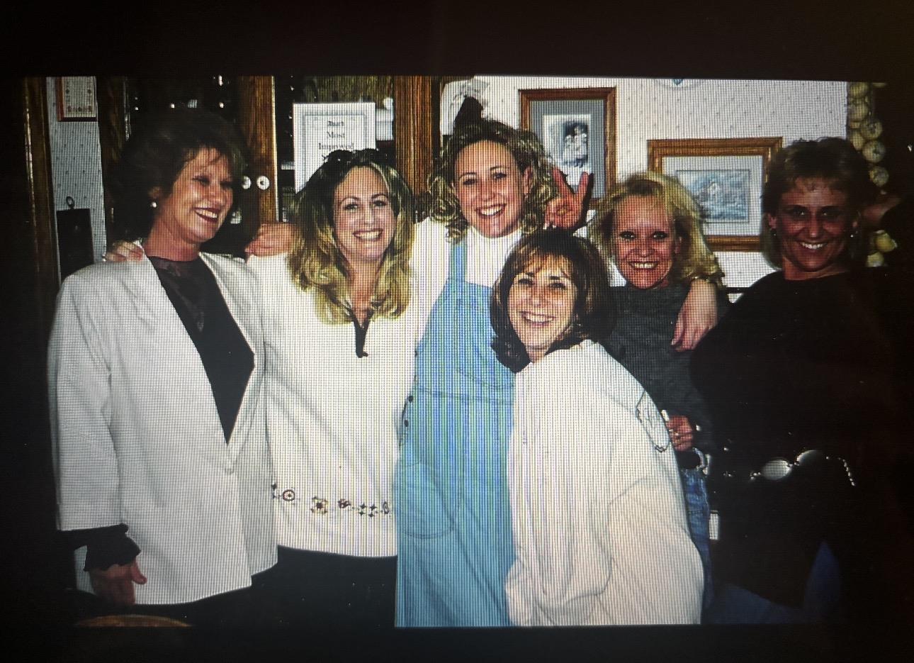 A group of women posing for a photo
