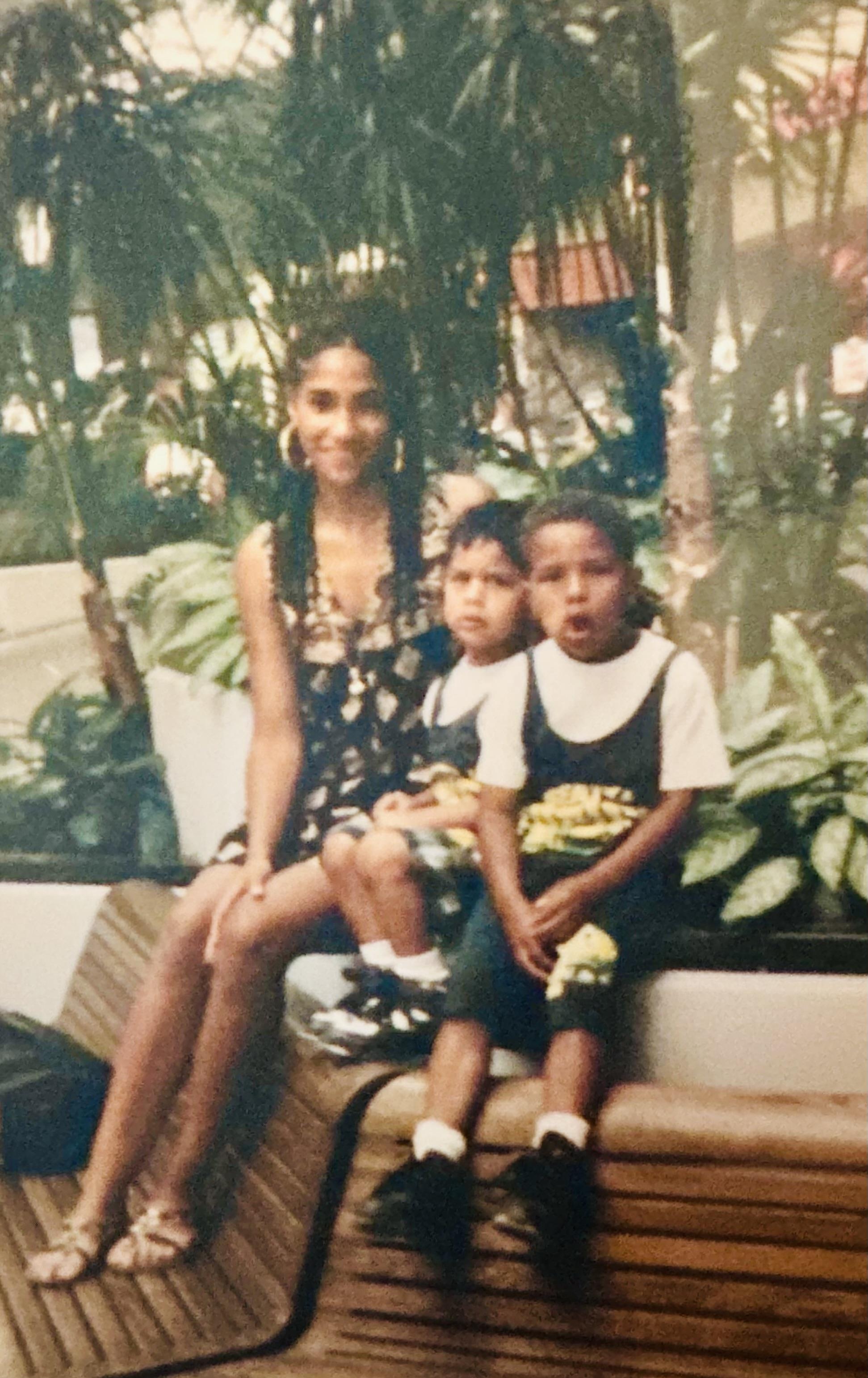 A woman and two children posing for a picture