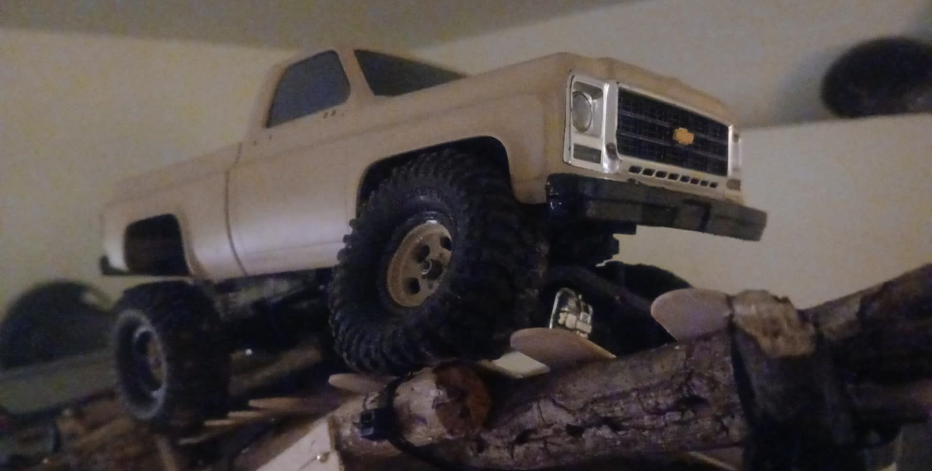 A toy truck on a log
