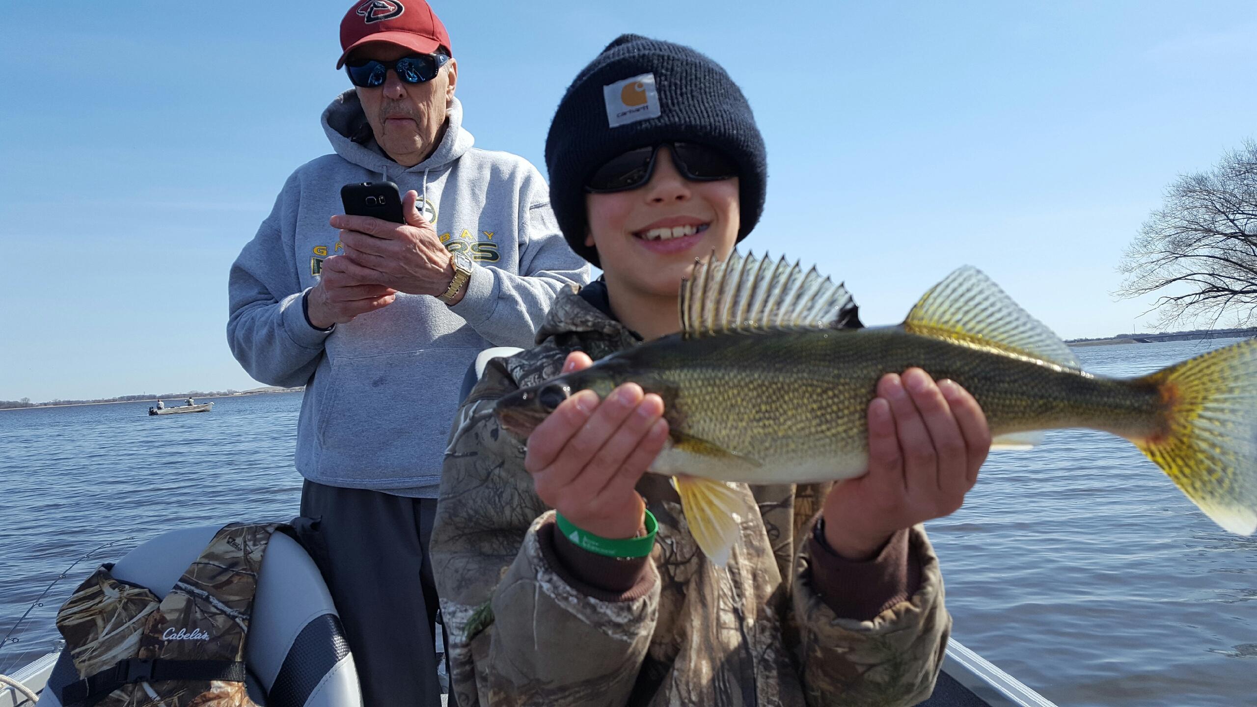 A boy holding a fish