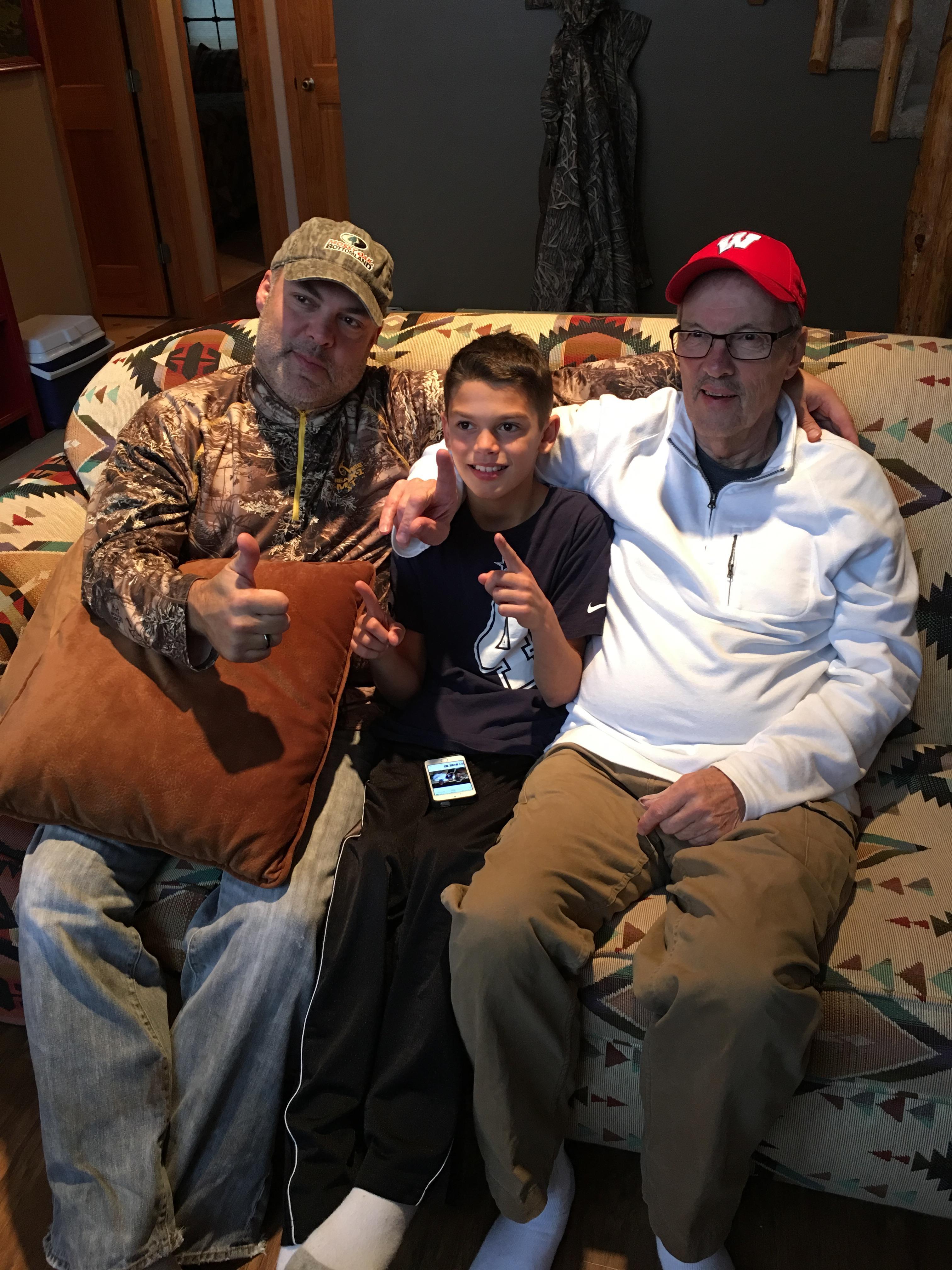 A group of men sitting on a couch