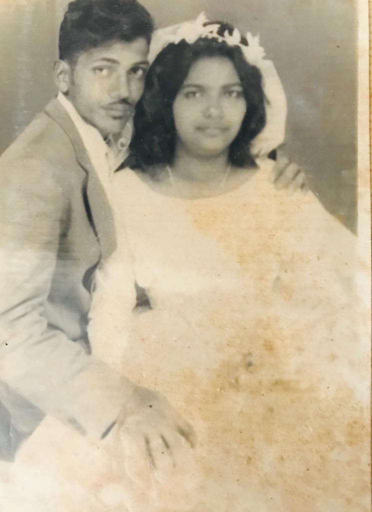 A man and woman posing for a picture